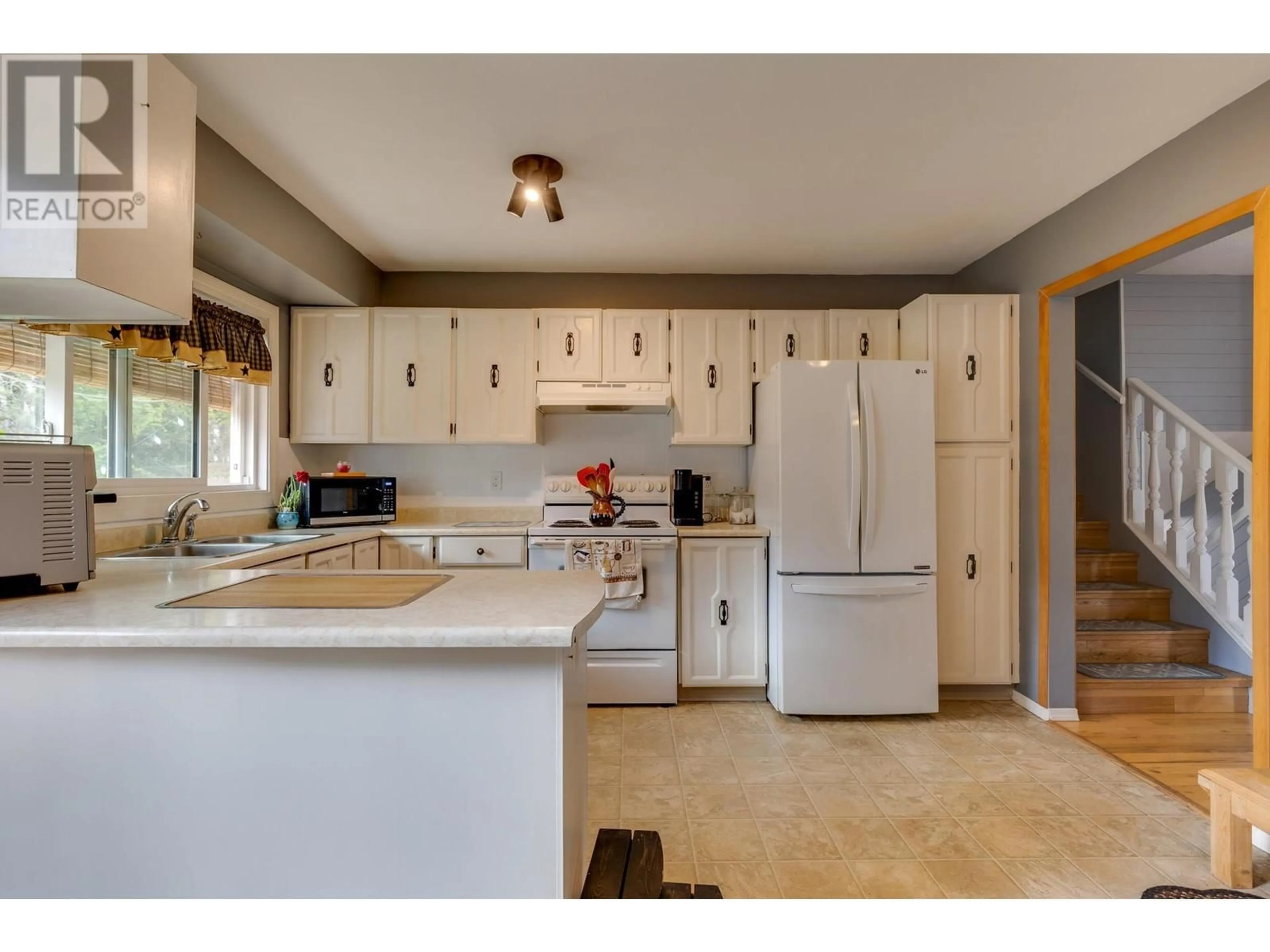 Open concept kitchen, ceramic/tile floor for 8145 ST LAWRENCE AVENUE, Prince George British Columbia V2N4K6