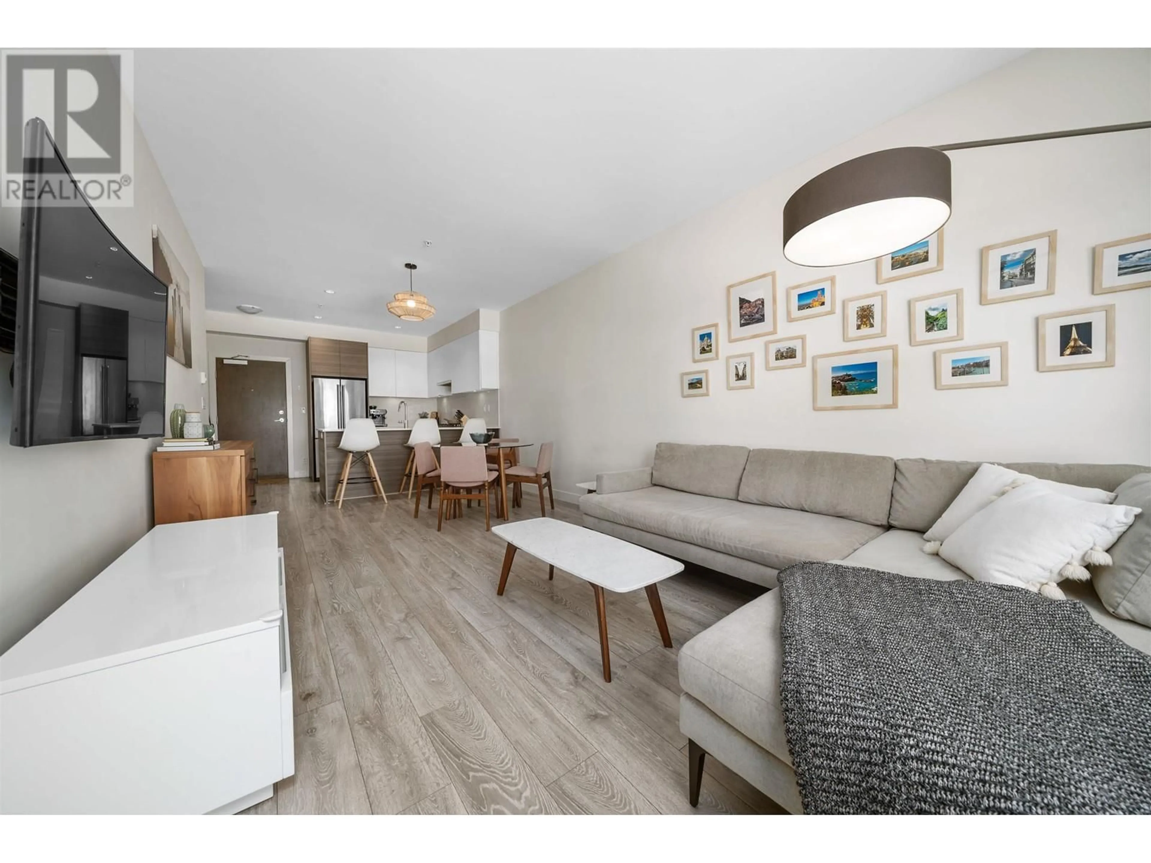 Living room with furniture, wood/laminate floor for 402 - 4468 DAWSON STREET, Burnaby British Columbia V5C0J9