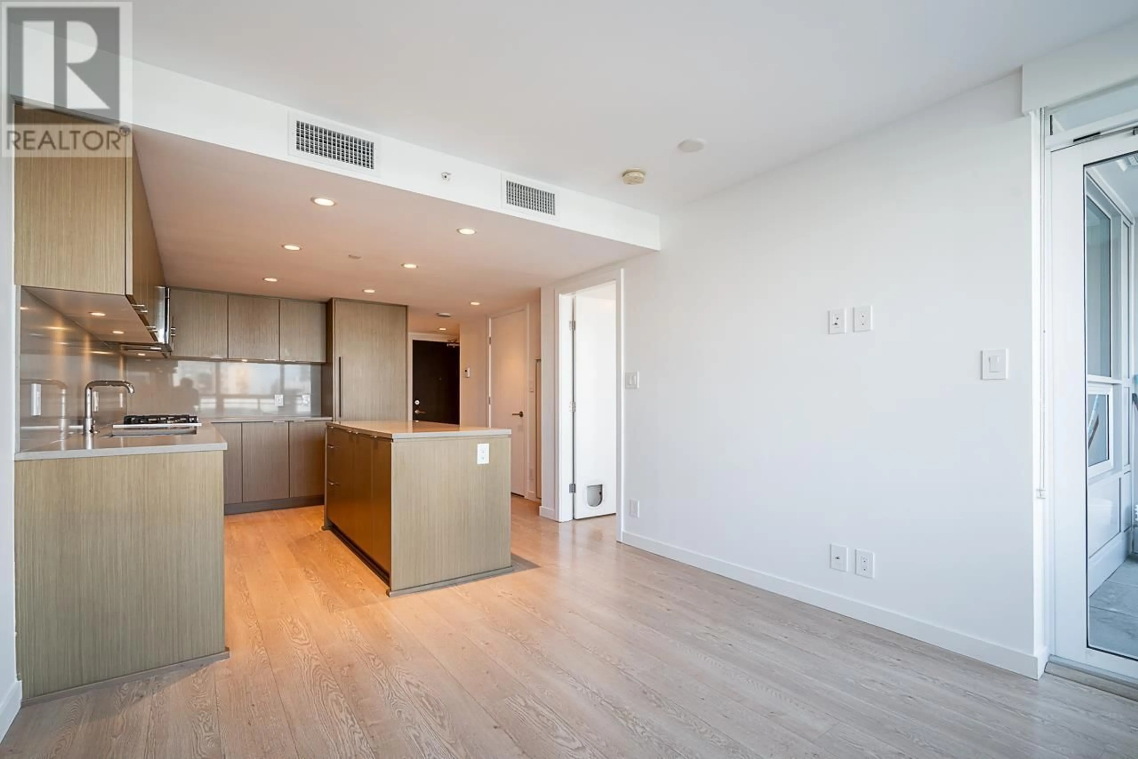 Open concept kitchen, wood/laminate floor for 306 - 125 14TH STREET, Vancouver British Columbia V7L0E6