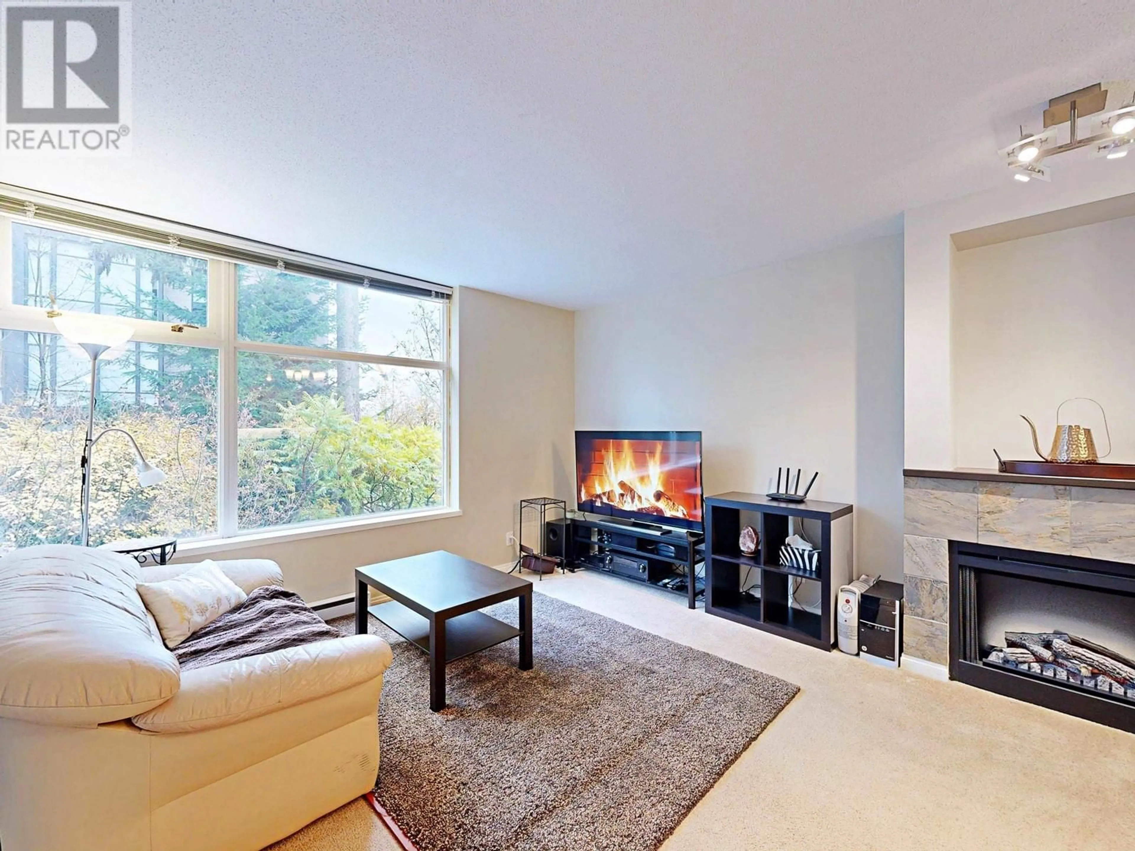 Living room with furniture, unknown for 101 - 9298 UNIVERSITY CRESCENT, Burnaby British Columbia V5A4X8