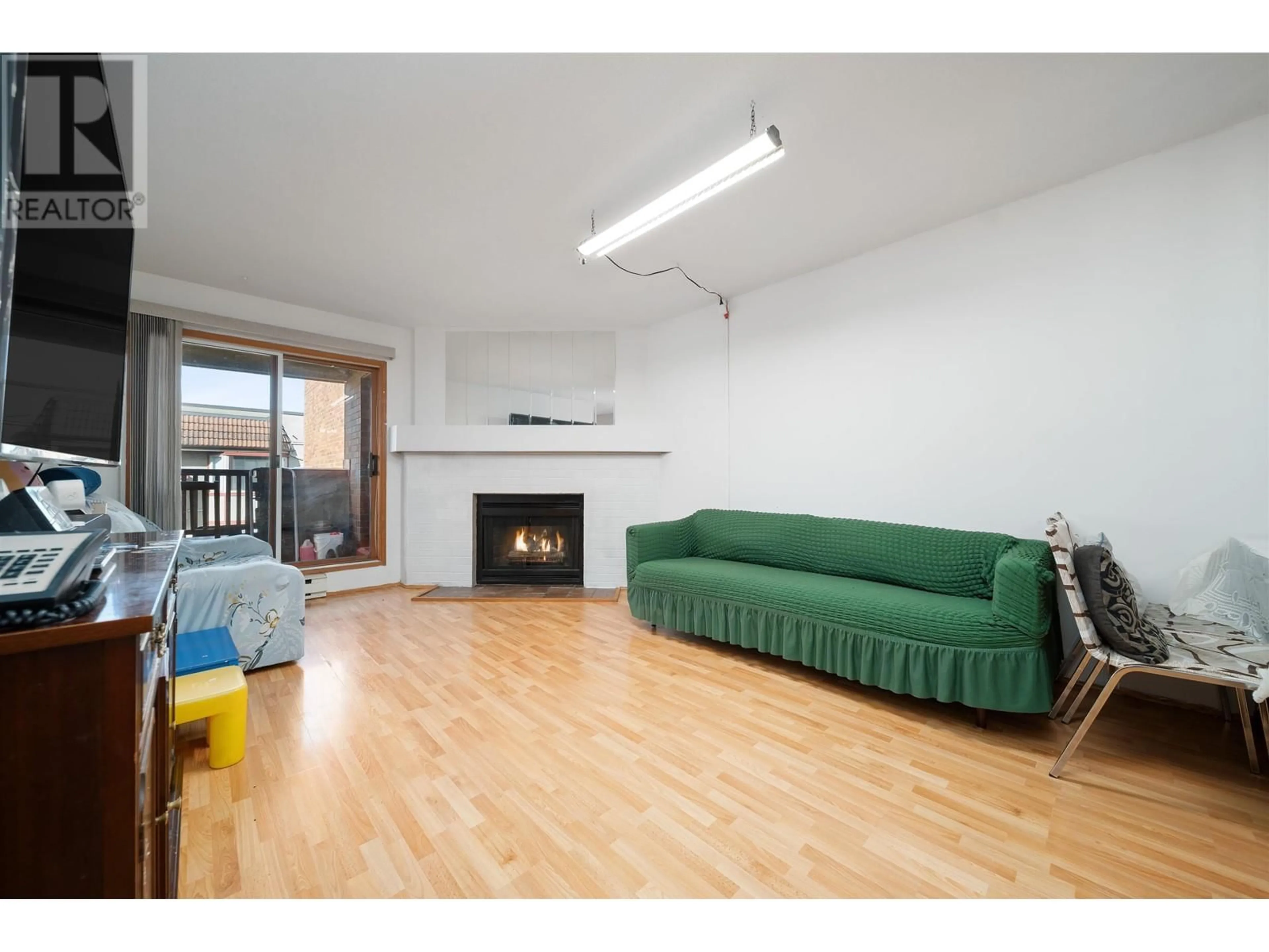 Living room with furniture, wood/laminate floor for 305 - 7511 MINORU BOULEVARD, Richmond British Columbia V6Y1Z3
