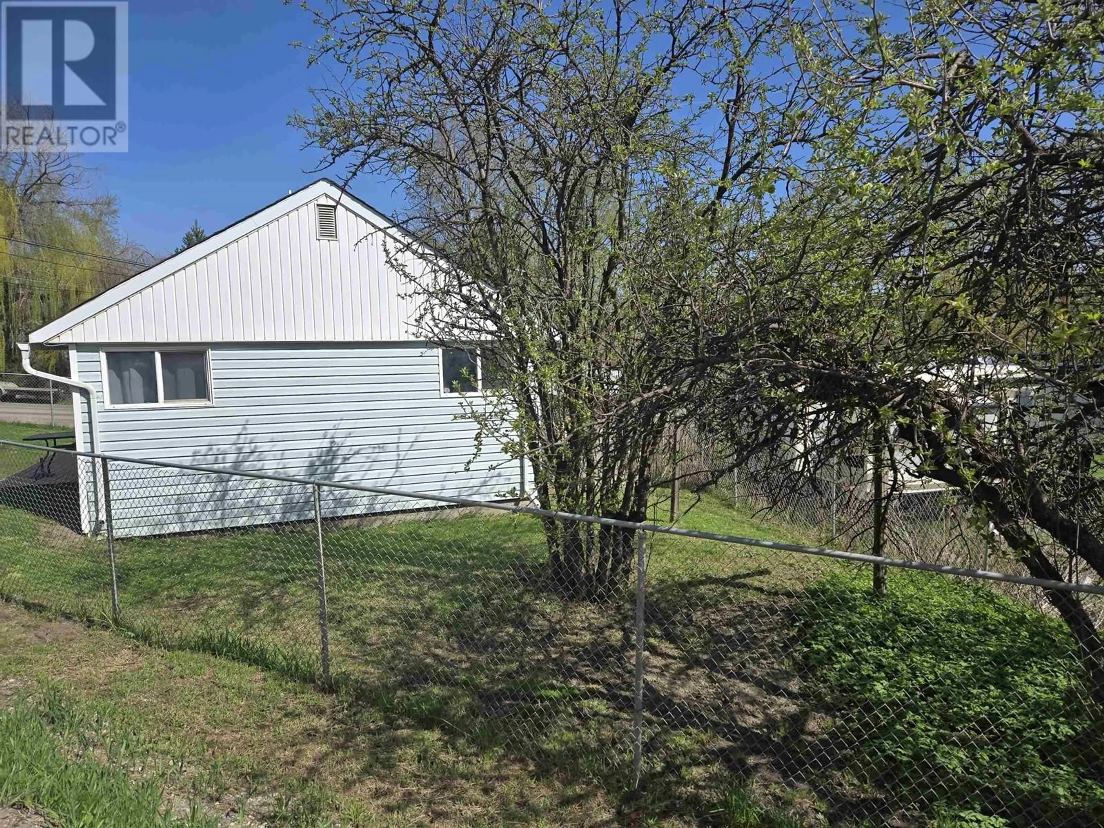 A pic from outside/outdoor area/front of a property/back of a property/a pic from drone, unknown for 582 NORTH FRASER DRIVE, Quesnel British Columbia V2J1Z5