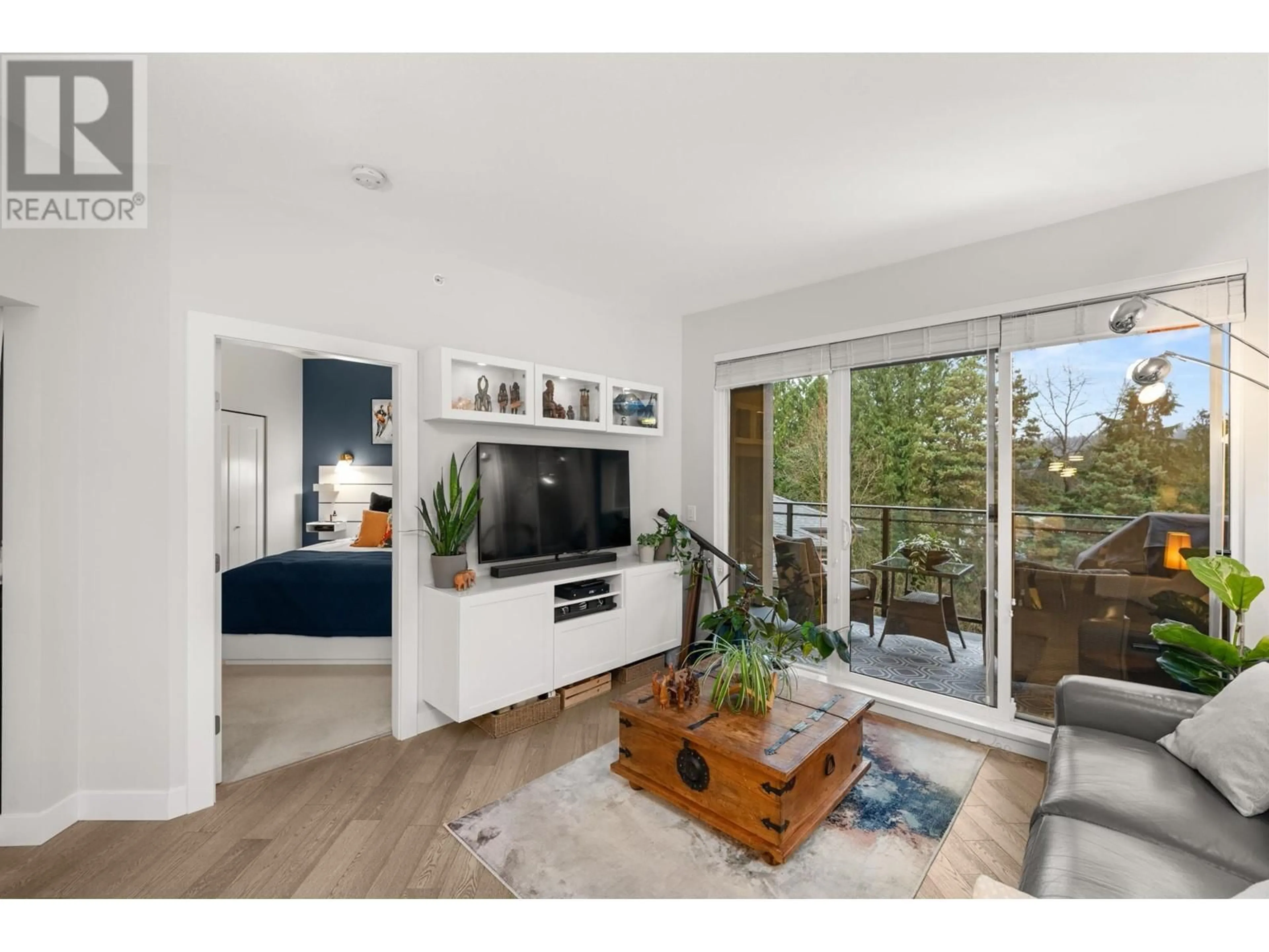 Living room with furniture, wood/laminate floor for 501 - 3399 NOEL DRIVE, Burnaby British Columbia V3J0G8