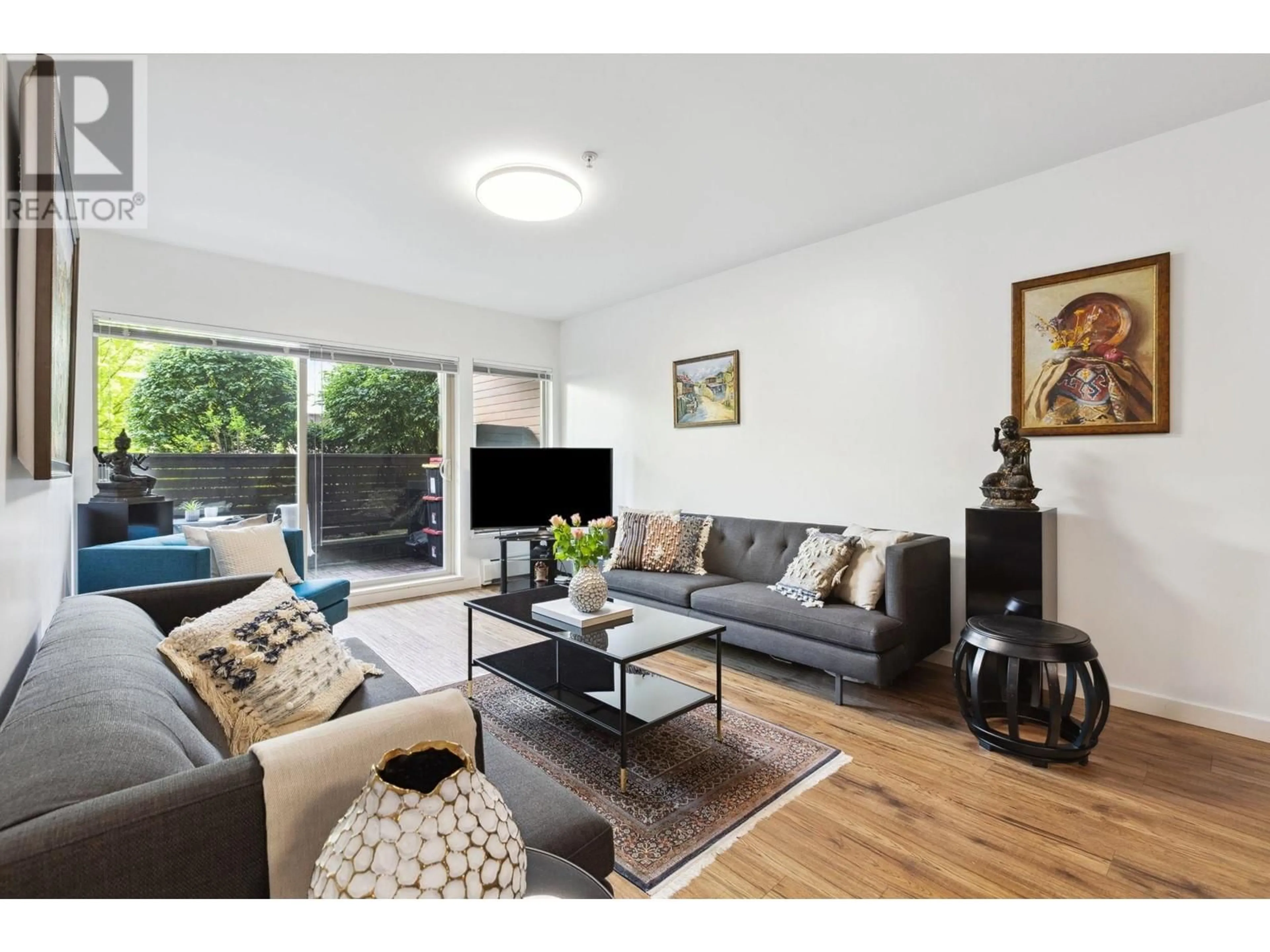 Living room with furniture, wood/laminate floor for 110 - 1033 ST. GEORGES AVENUE, North Vancouver British Columbia V7L3H5