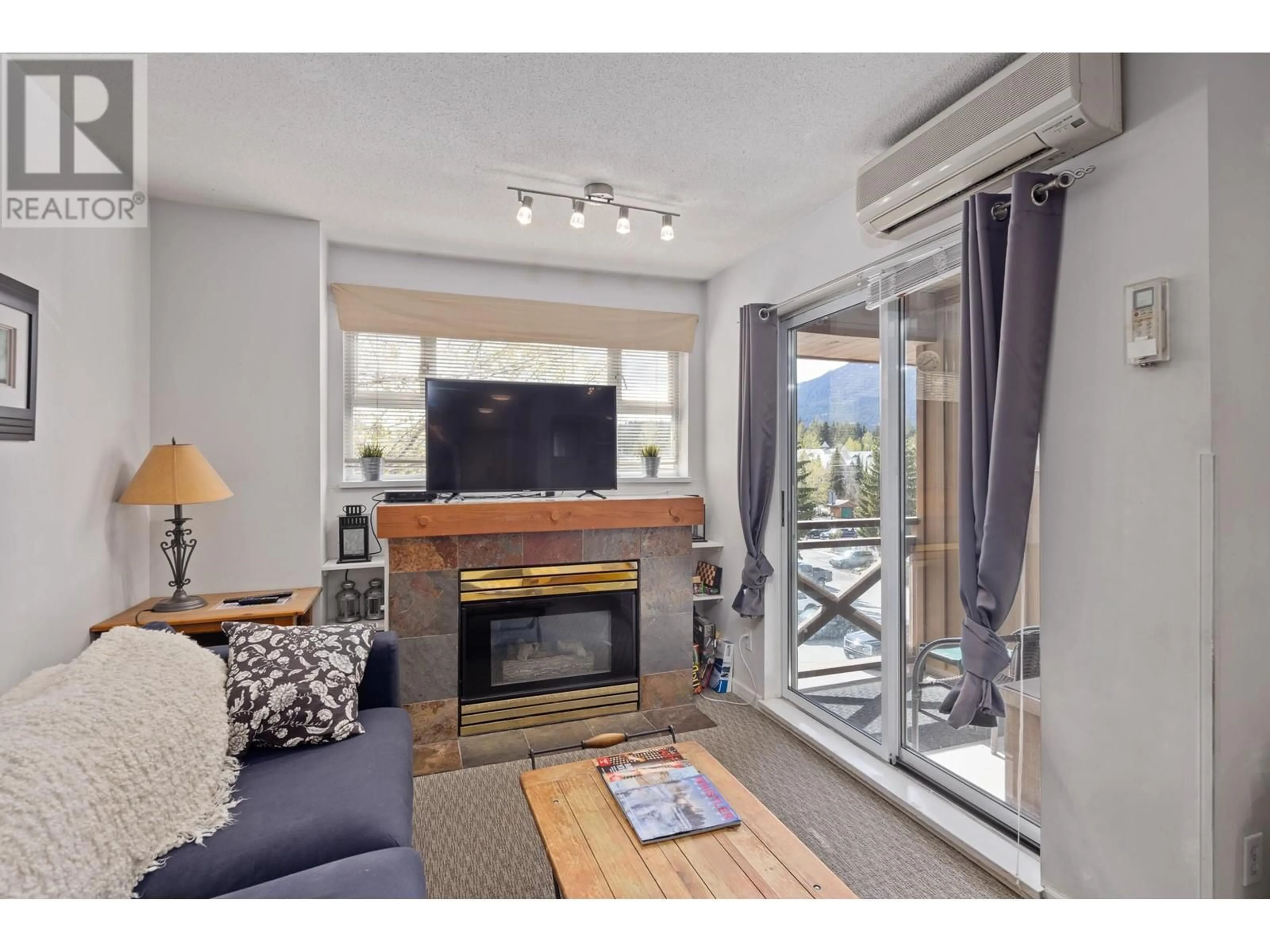 Living room with furniture, wood/laminate floor for 310 - 4360 LORIMER ROAD, Whistler British Columbia V8E1A0