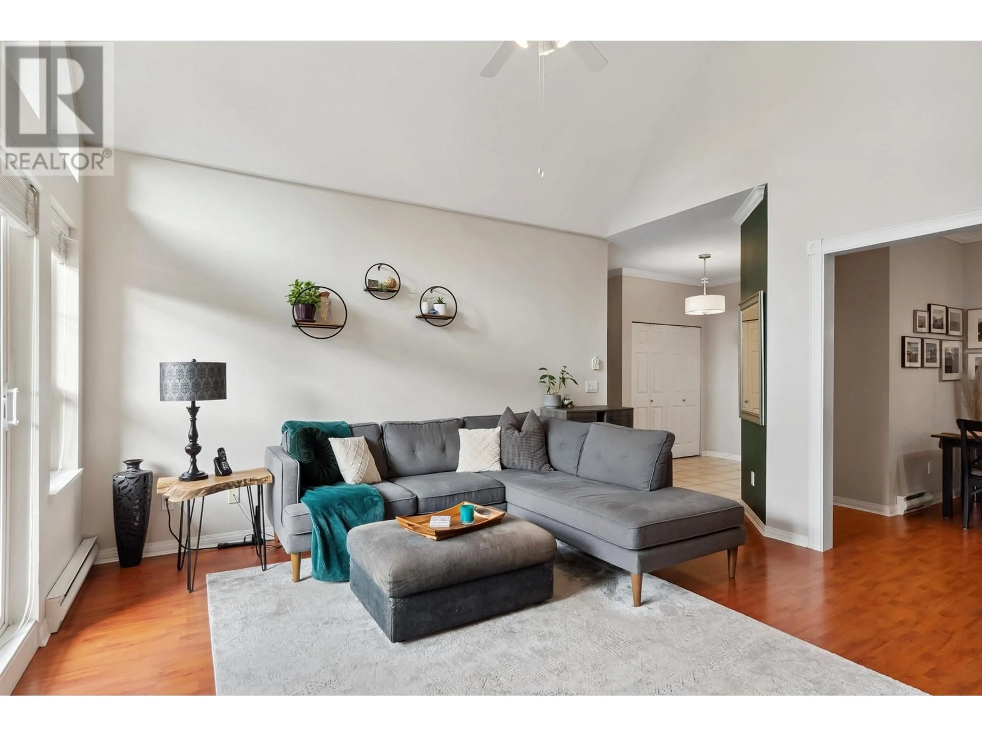 Living room with furniture, wood/laminate floor for 207 - 4747 54A STREET, Ladner British Columbia V4K2Z9
