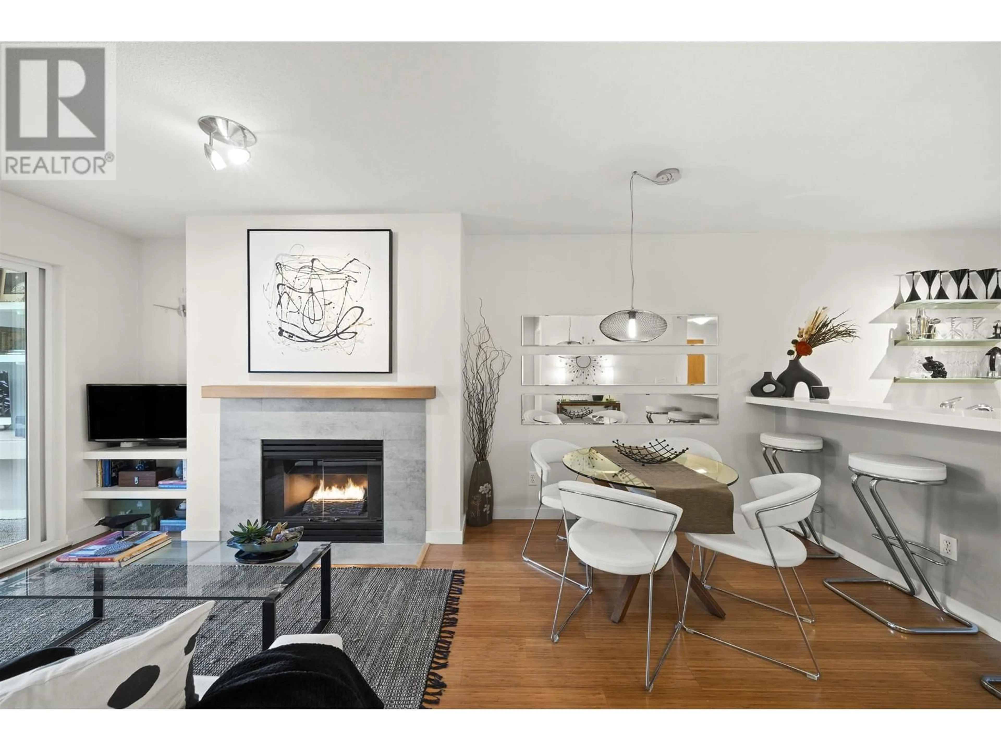 Living room with furniture, wood/laminate floor for 302 - 1011 W KING EDWARD AVENUE, Vancouver British Columbia V6H1Z3