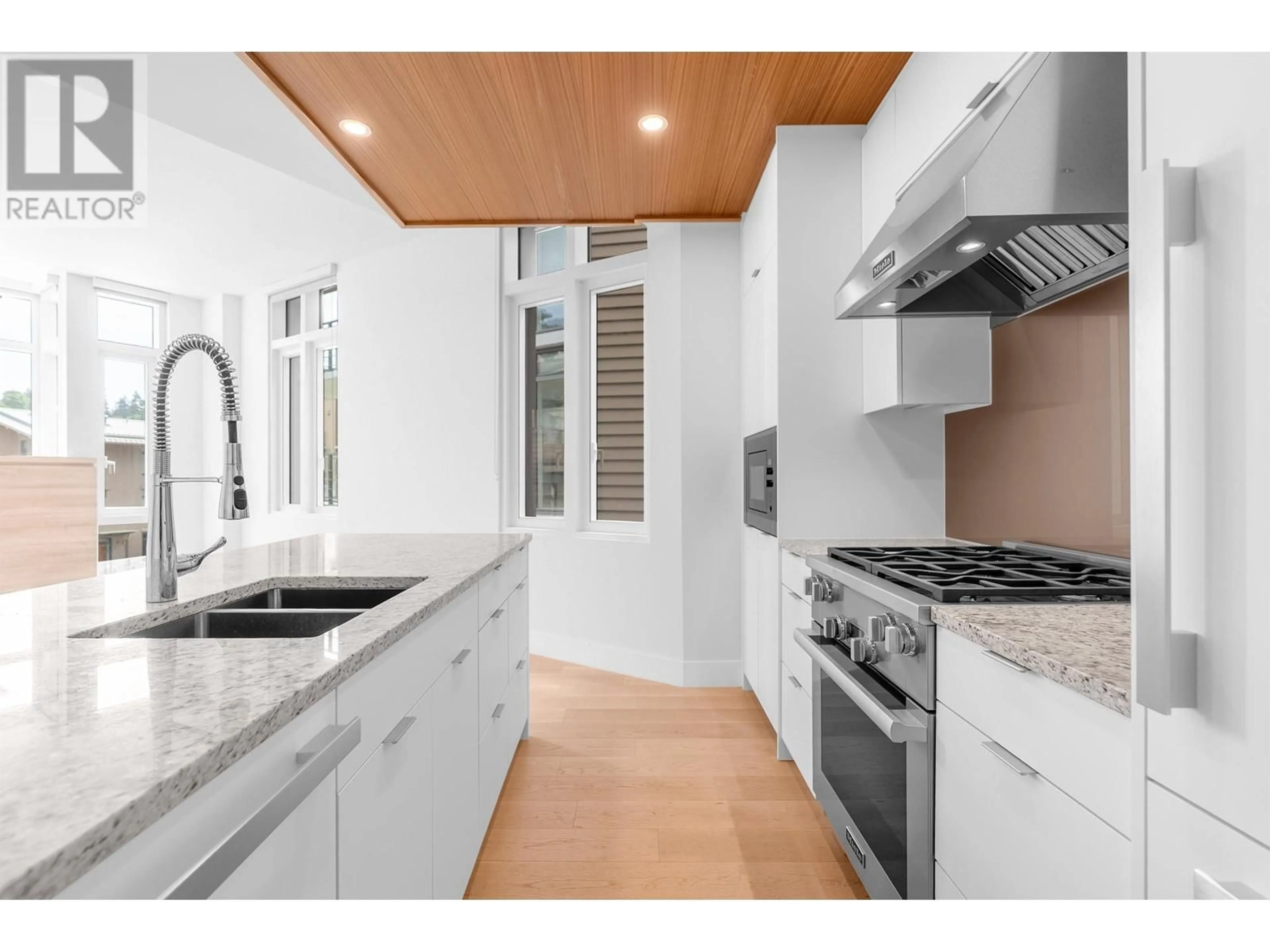 Contemporary kitchen, ceramic/tile floor for 404 - 6699 NELSON AVENUE, West Vancouver British Columbia V7W2B2