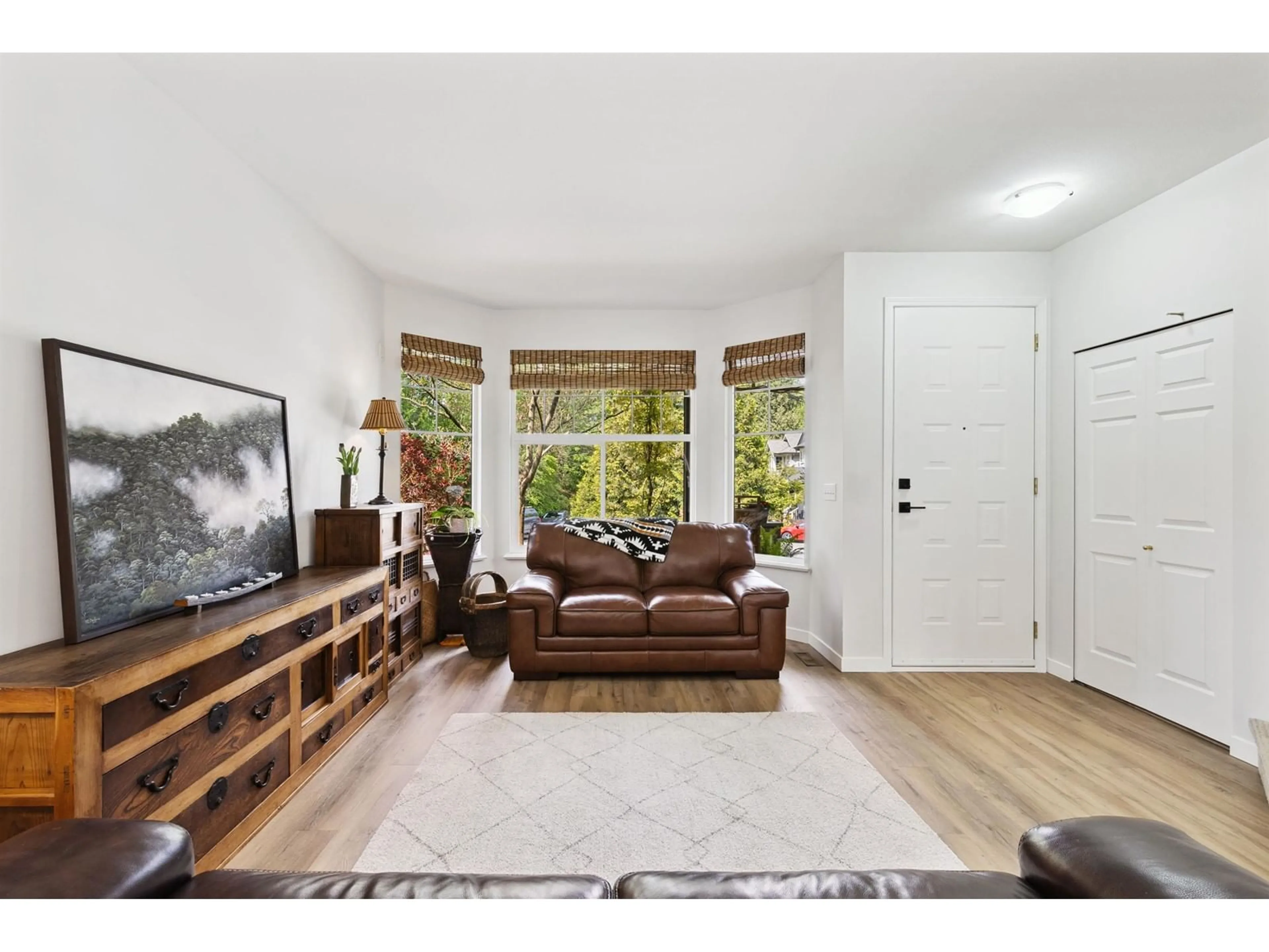 Living room with furniture, wood/laminate floor for 20649 86A, Langley British Columbia V1M3X3