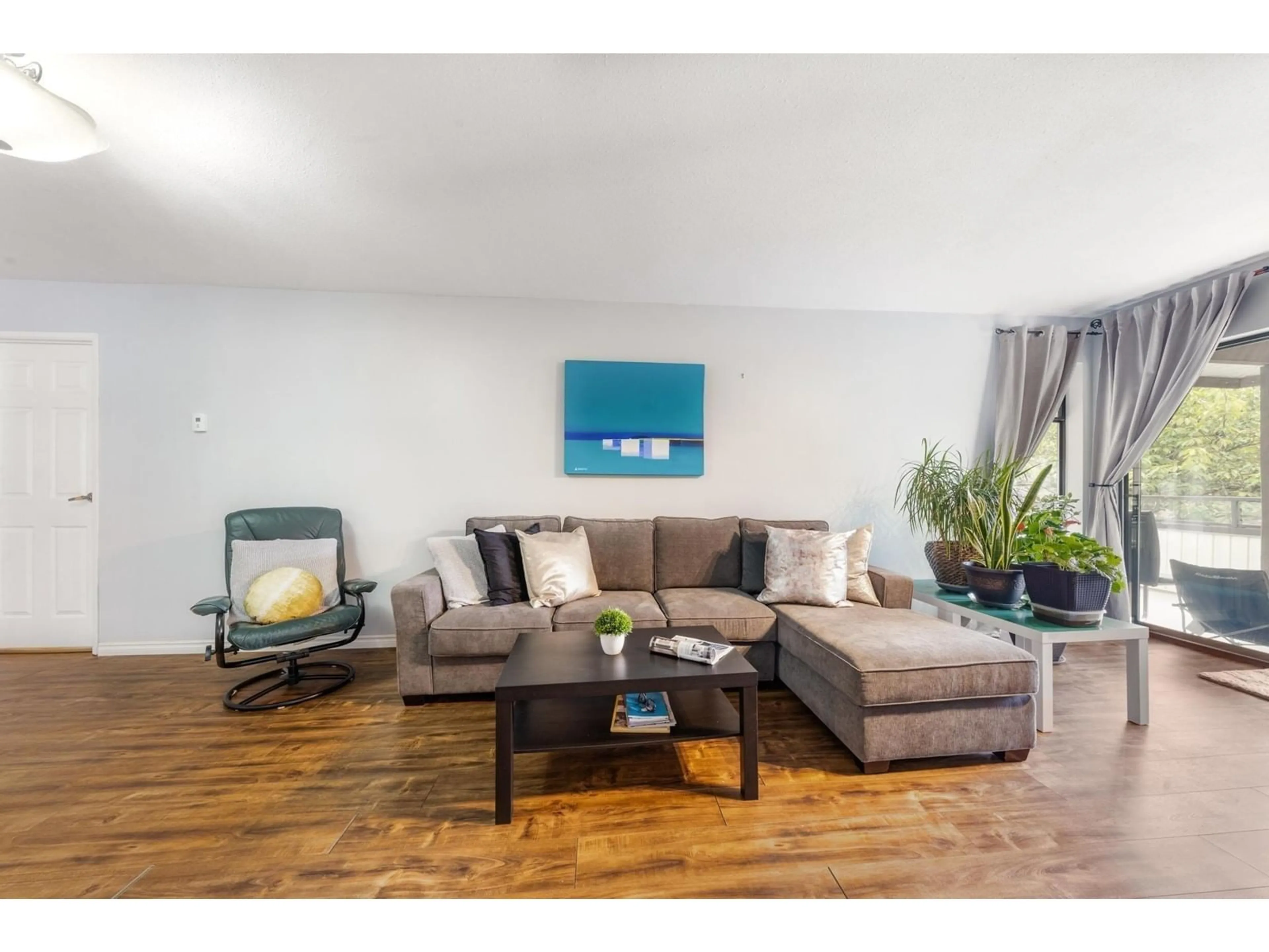 Living room with furniture, wood/laminate floor for 236 - 15153 98, Surrey British Columbia V3R9M8