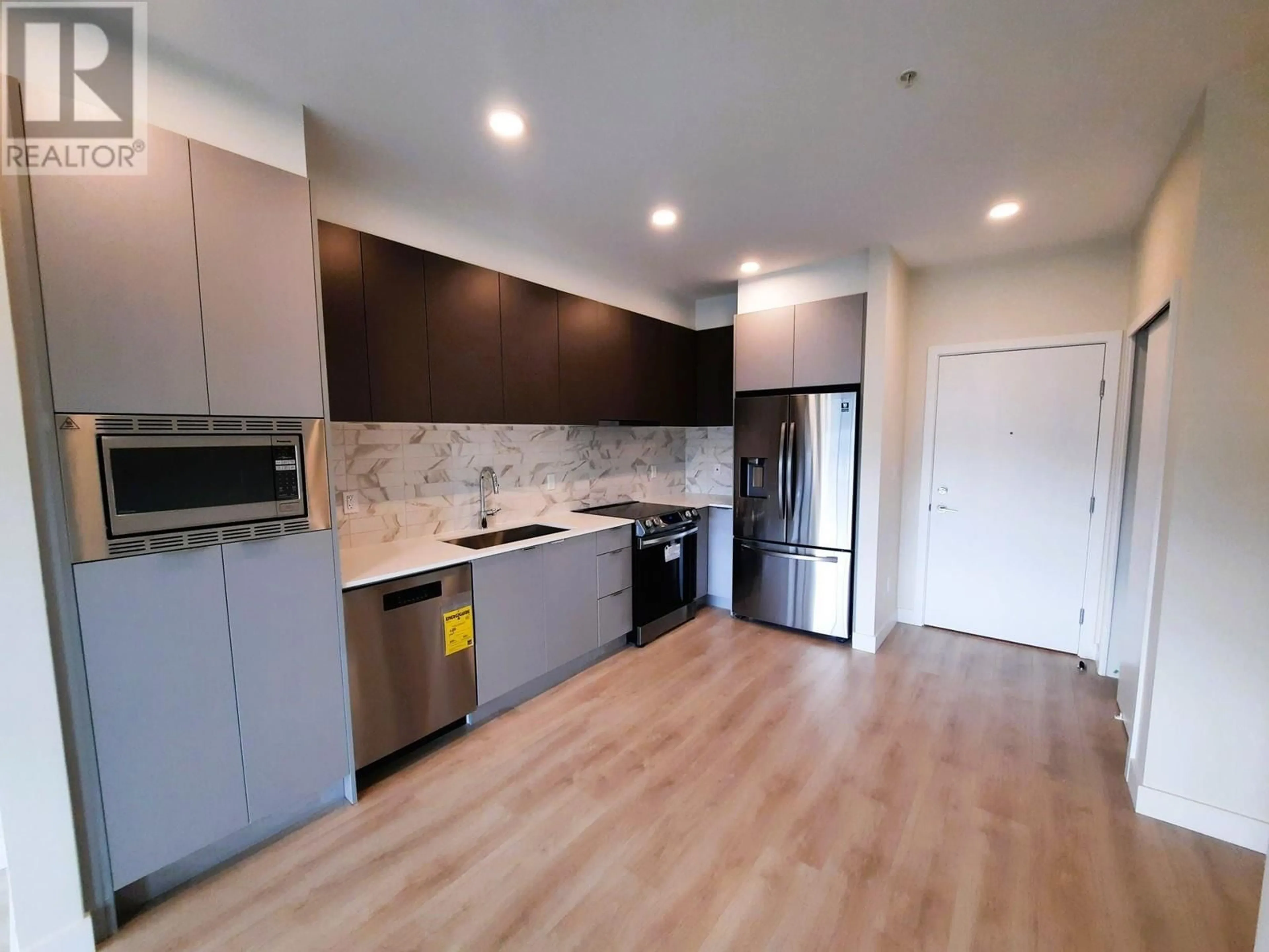 Open concept kitchen, wood/laminate floor for 203 - 1792 STARLING DRIVE, Delta British Columbia V4M0E4