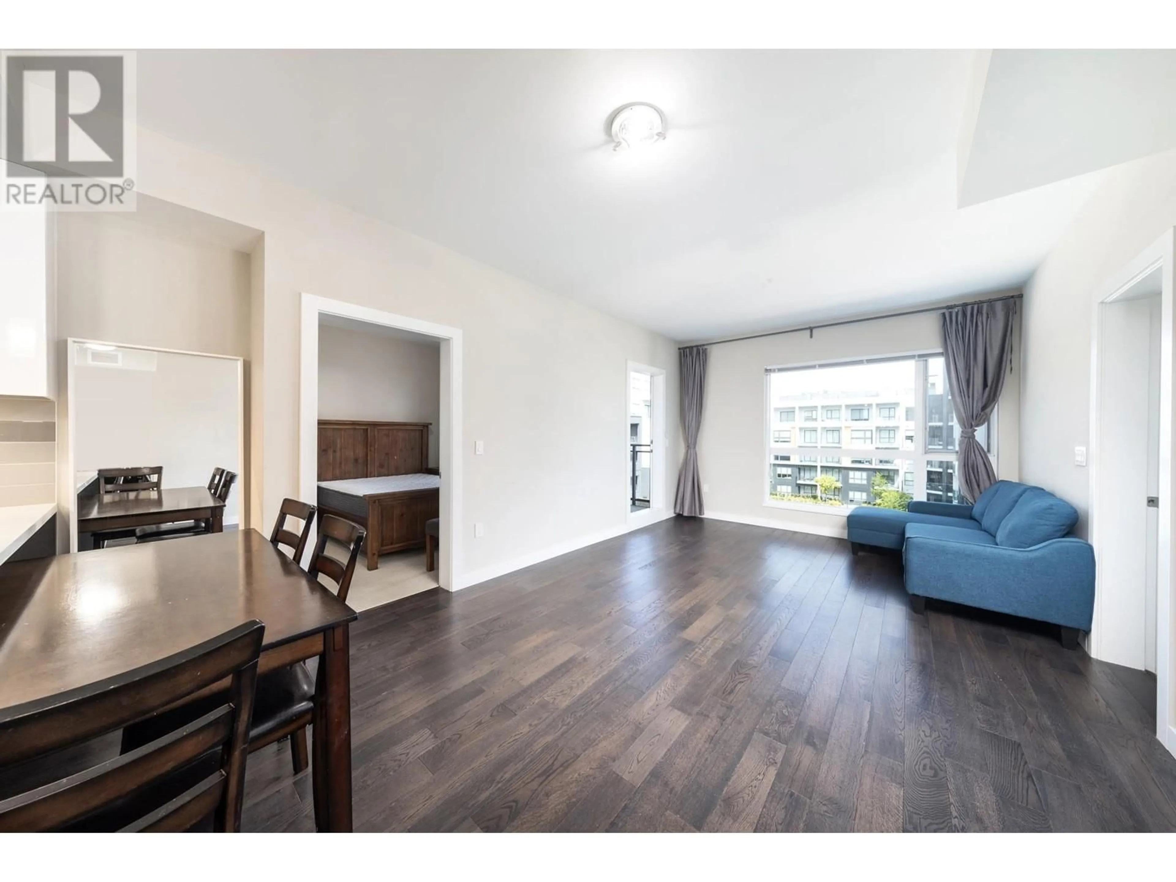 Living room with furniture, wood/laminate floor for 517 - 5399 CEDARBRIDGE WAY, Richmond British Columbia V6X0L6