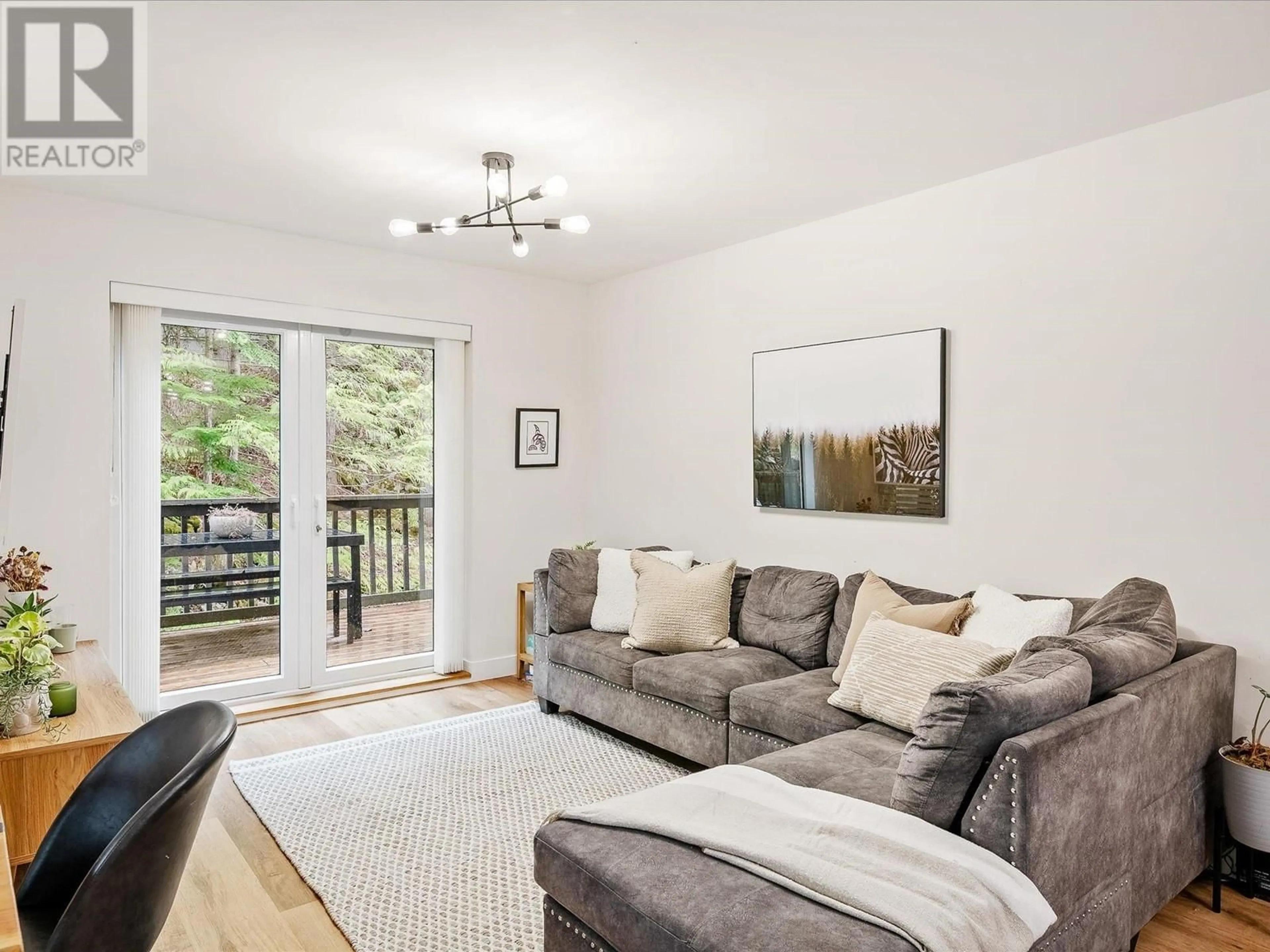 Living room with furniture, wood/laminate floor for 1A - 2230 EVA LAKE ROAD, Whistler British Columbia V8E0M5