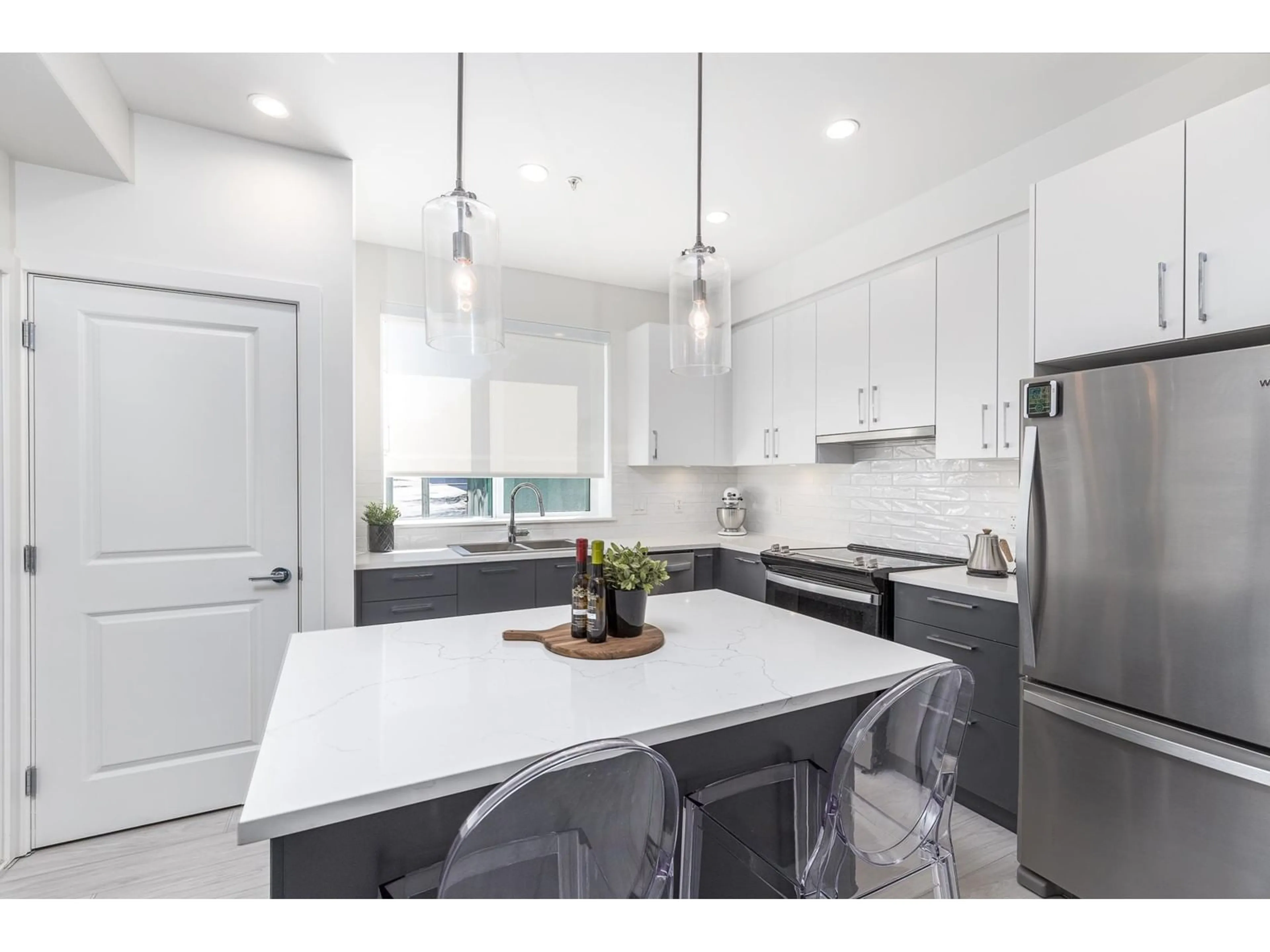 Open concept kitchen, ceramic/tile floor for A102 - 20834 80, Langley British Columbia V2Y3M3