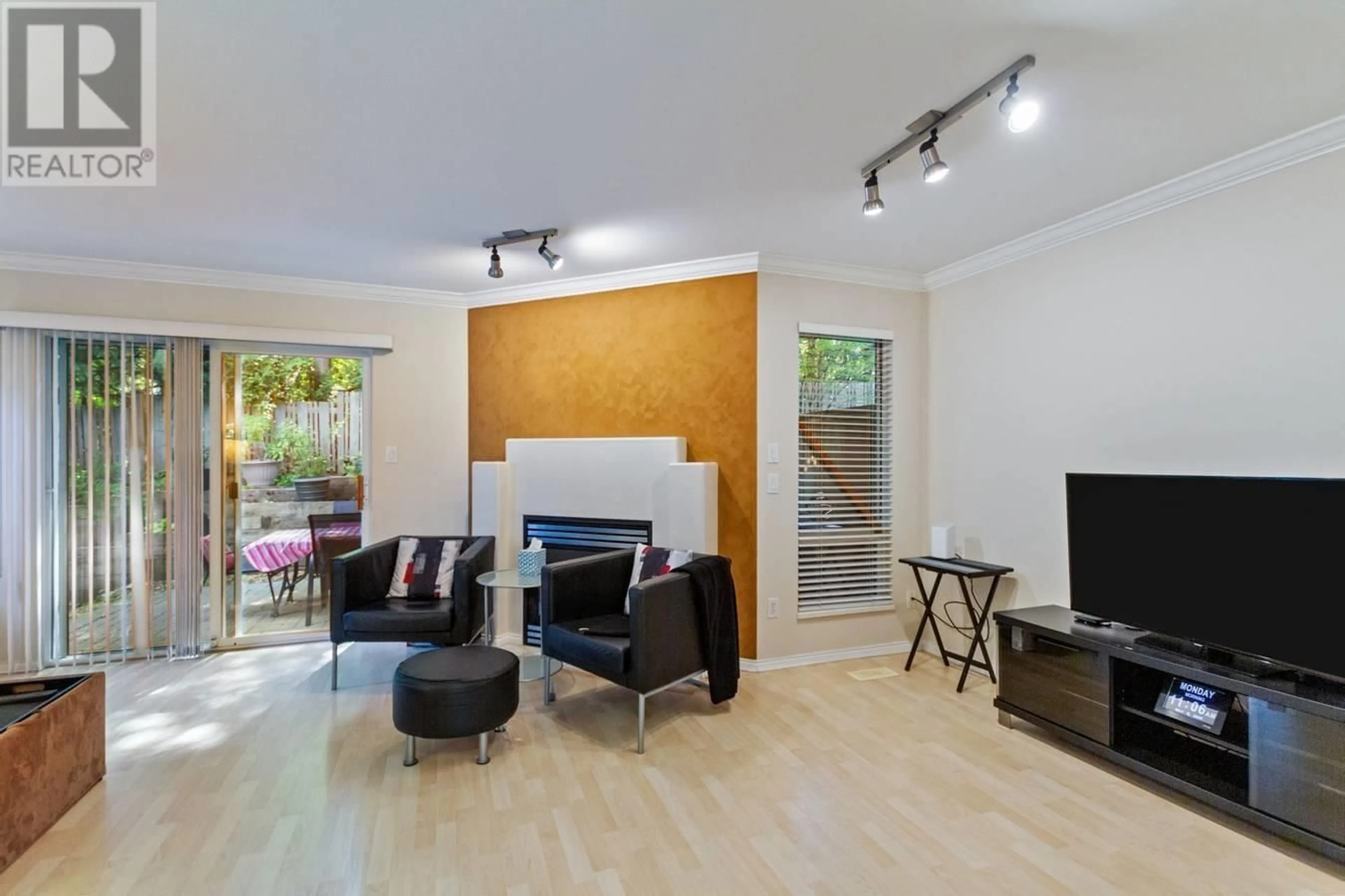 Living room with furniture, wood/laminate floor for 25 - 8701 16TH AVENUE, Burnaby British Columbia V3N5B5