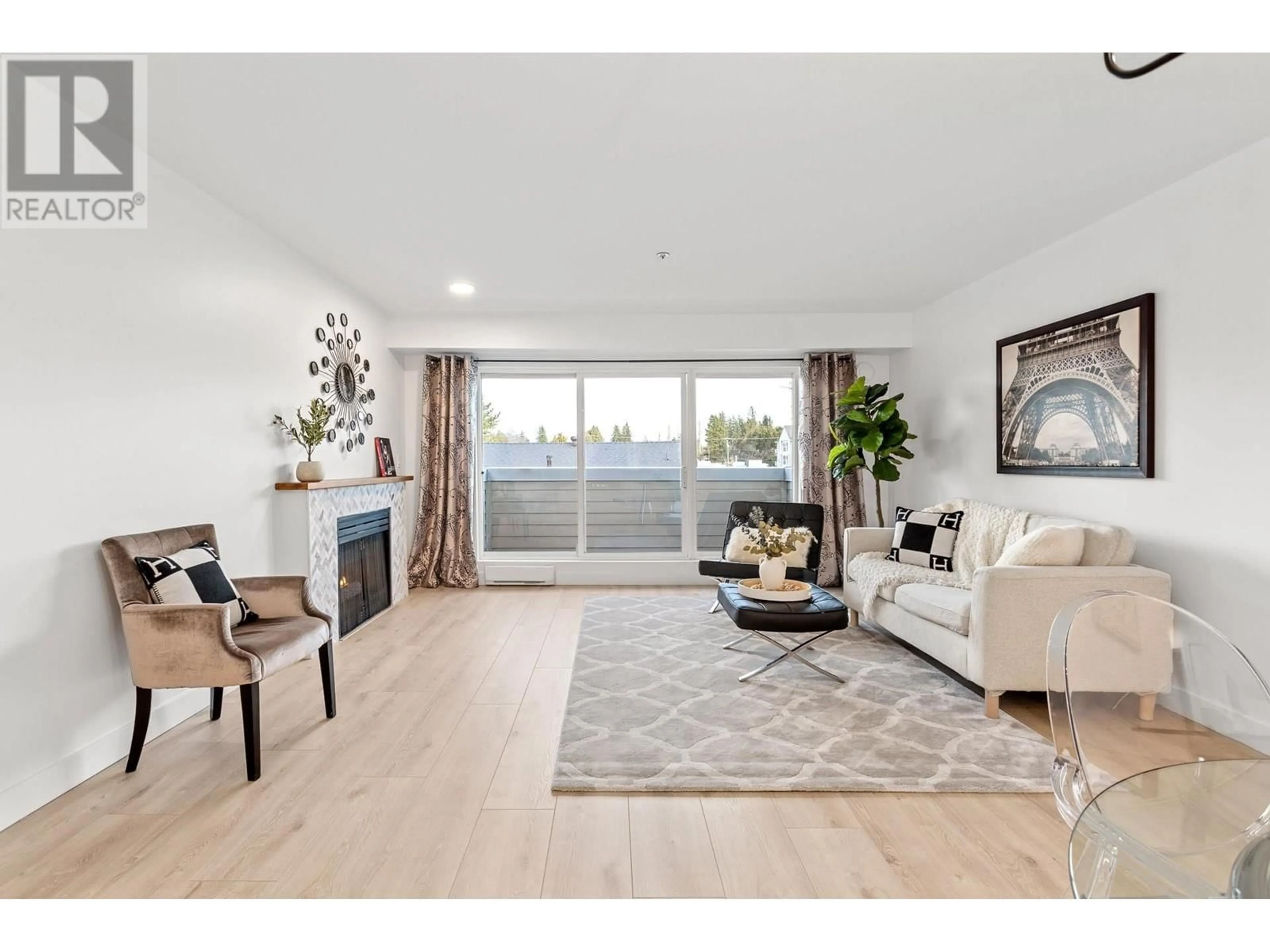 Living room with furniture, wood/laminate floor for 203 - 1570 PRAIRIE AVENUE, Port Coquitlam British Columbia V3B1T4