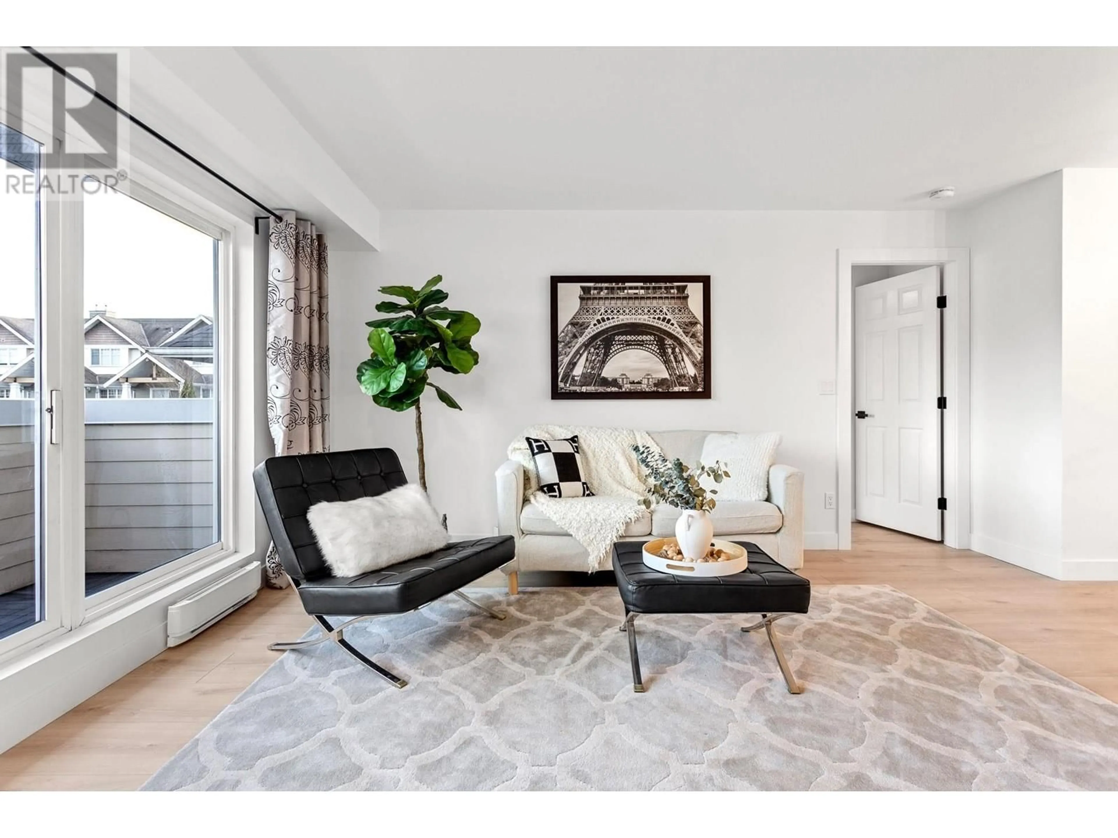 Living room with furniture, unknown for 203 - 1570 PRAIRIE AVENUE, Port Coquitlam British Columbia V3B1T4