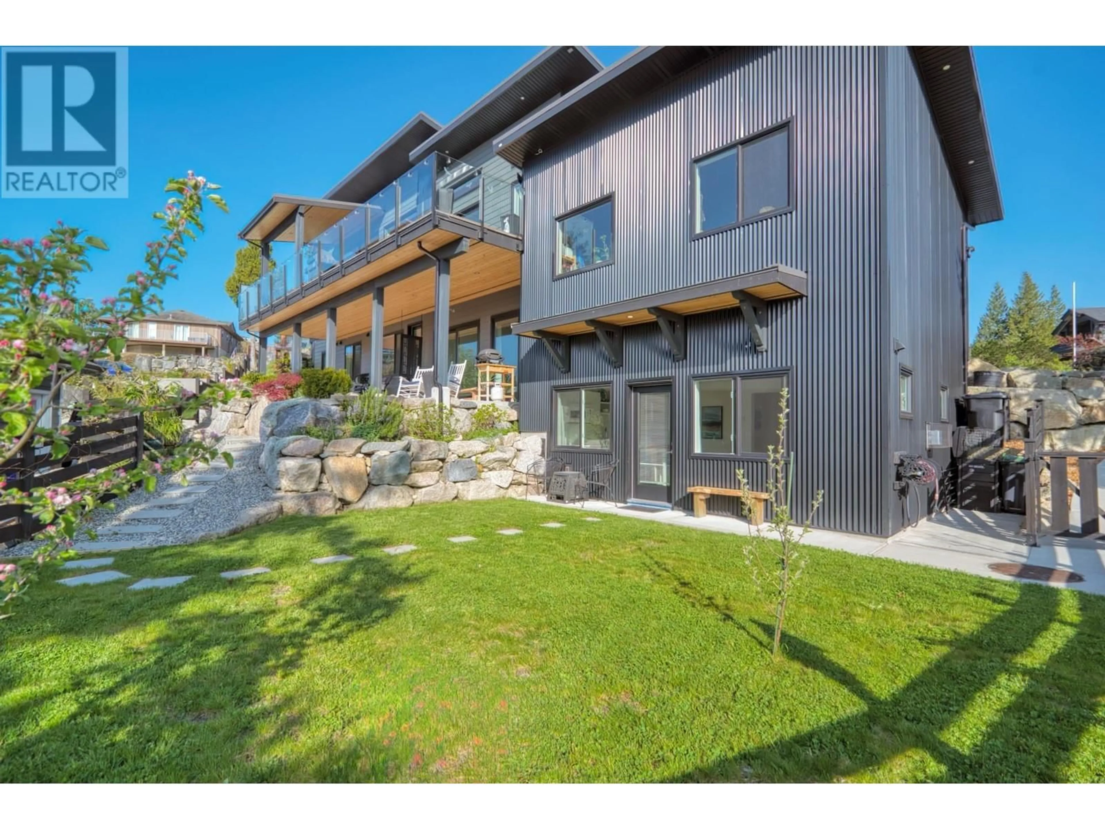 A pic from outside/outdoor area/front of a property/back of a property/a pic from drone, mountain view for 5769 GENNI'S WAY, Sechelt British Columbia V7Z0N8