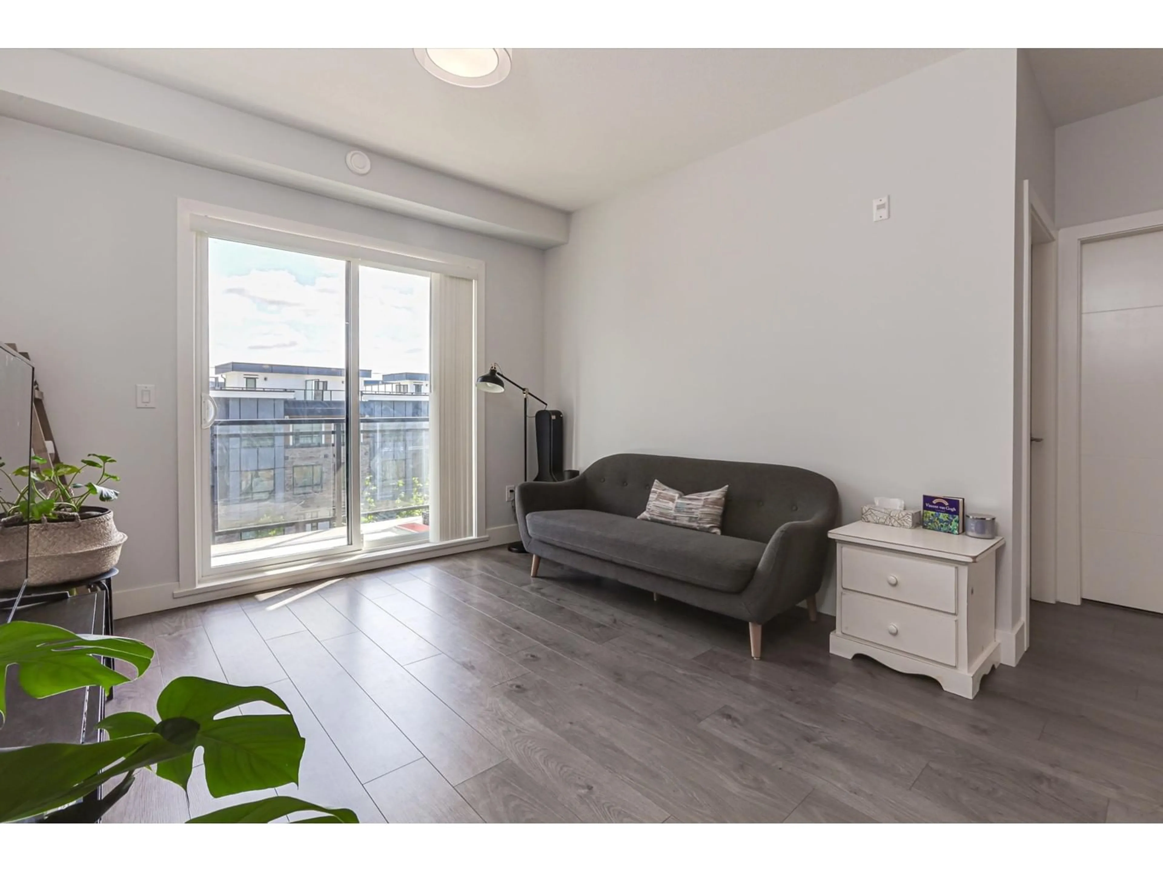 Living room with furniture, wood/laminate floor for 309 - 5485 BRYDON, Langley British Columbia V3A0N5
