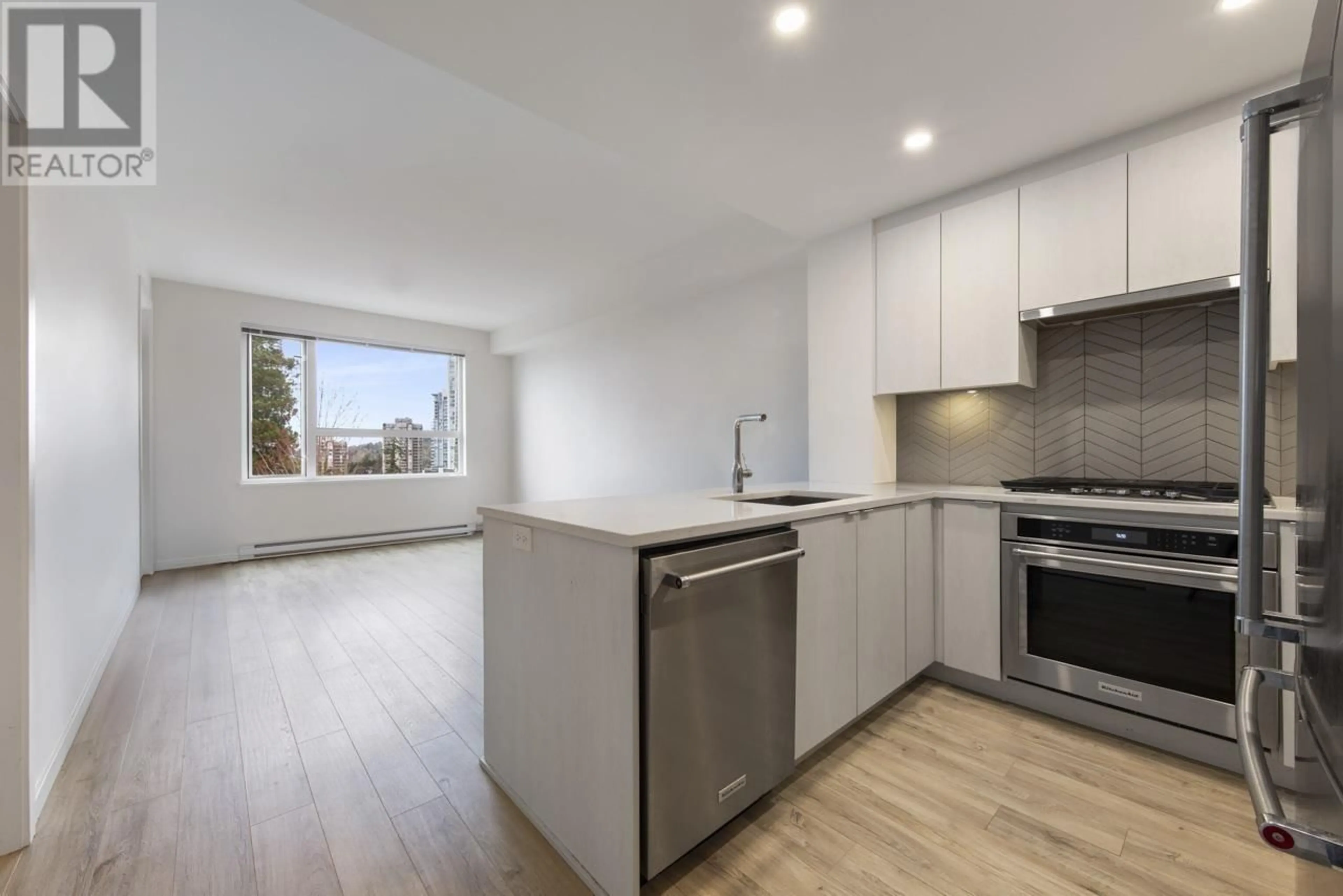 Open concept kitchen, wood/laminate floor for 410 - 717 BRESLAY STREET, Coquitlam British Columbia V3J0J3