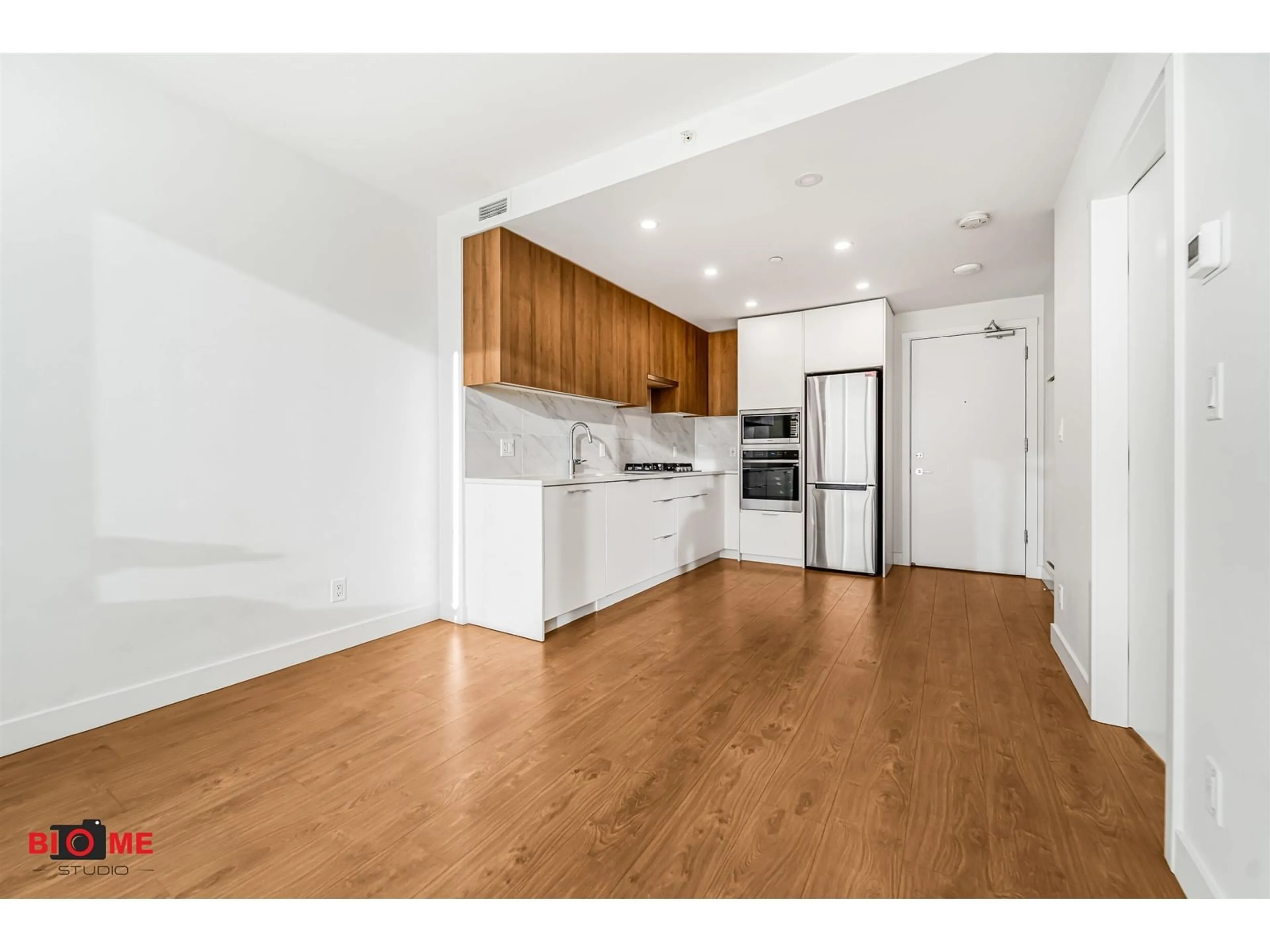 Open concept kitchen, wood/laminate floor for 2308 - 13359 OLD YALE, Surrey British Columbia V3T0S4