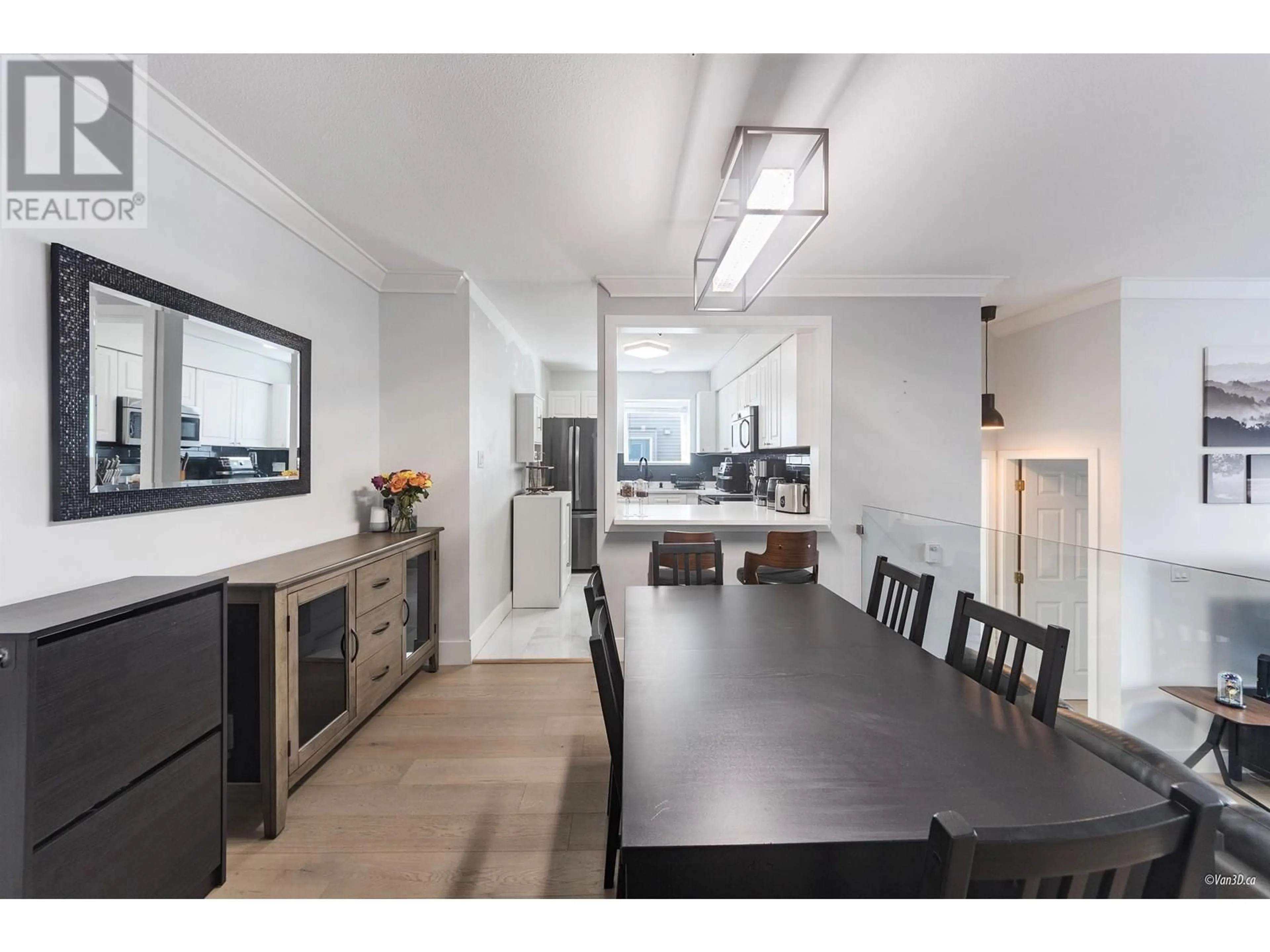 Open concept kitchen, wood/laminate floor for 202 - 7071 BLUNDELL ROAD, Richmond British Columbia V6Y1J5