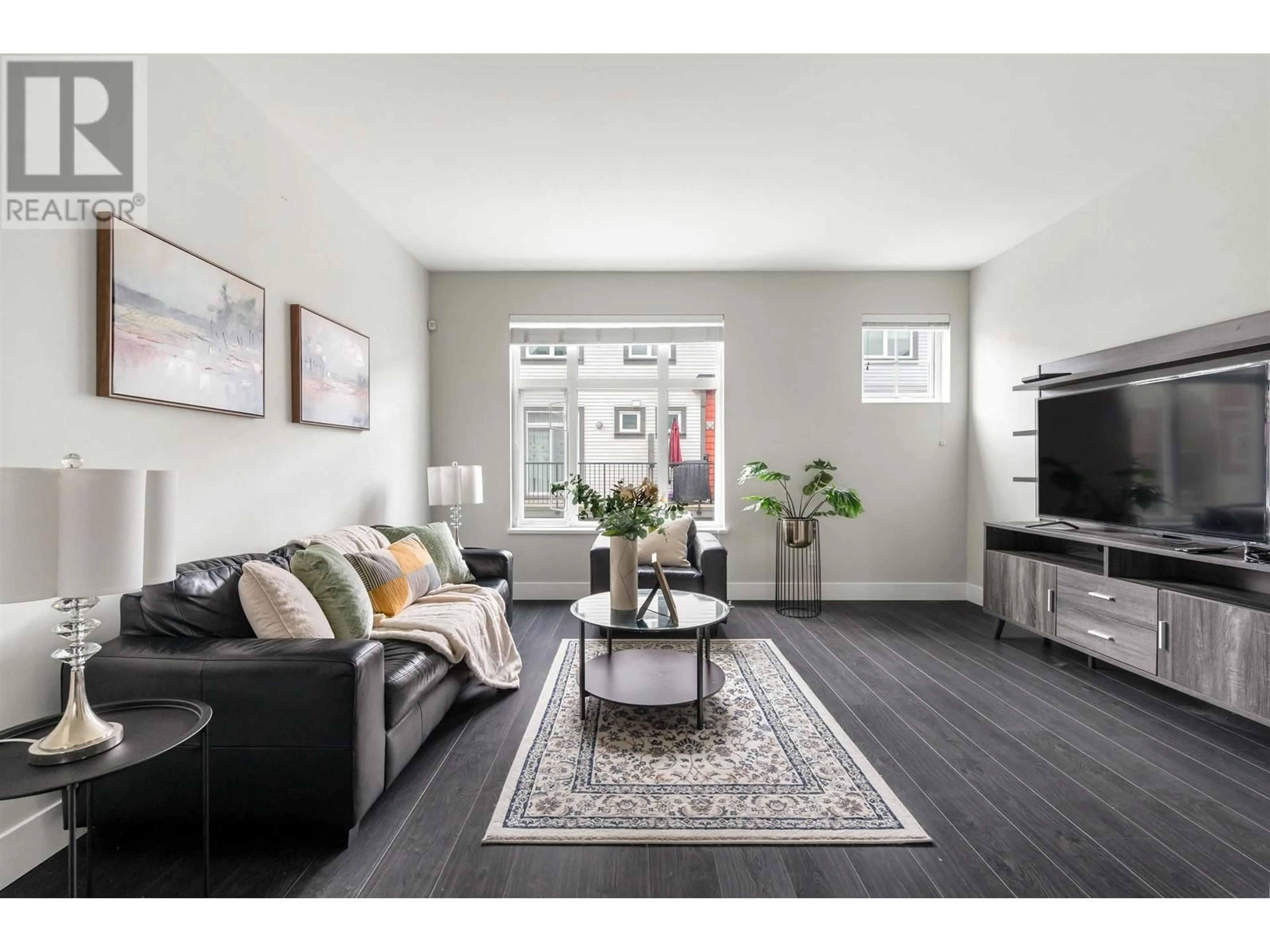 Living room with furniture, wood/laminate floor for 20 - 4588 DUBBERT STREET, Richmond British Columbia V6X0M1