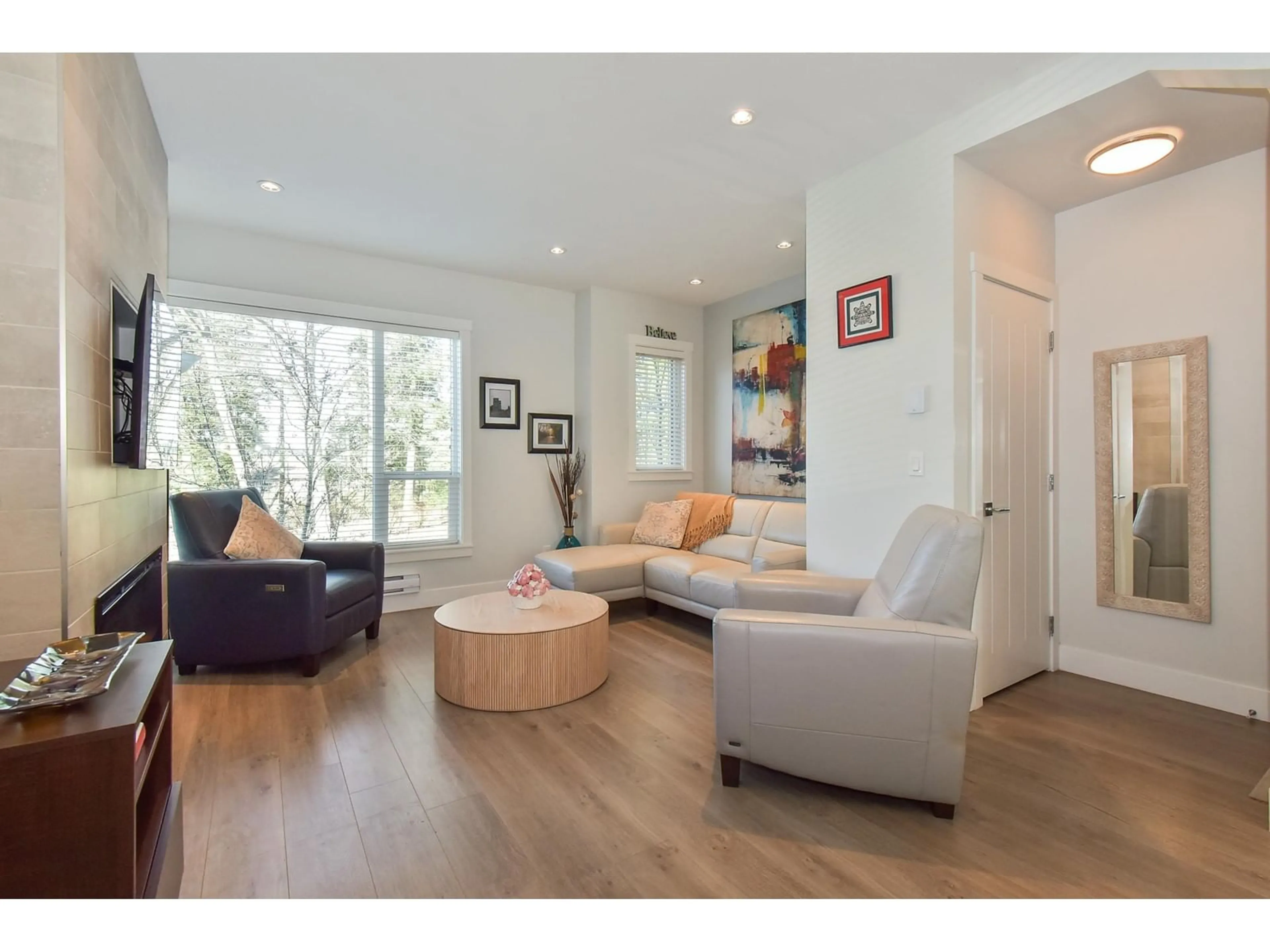 Living room with furniture, wood/laminate floor for 163 - 2280 163, Surrey British Columbia V3Z0S4