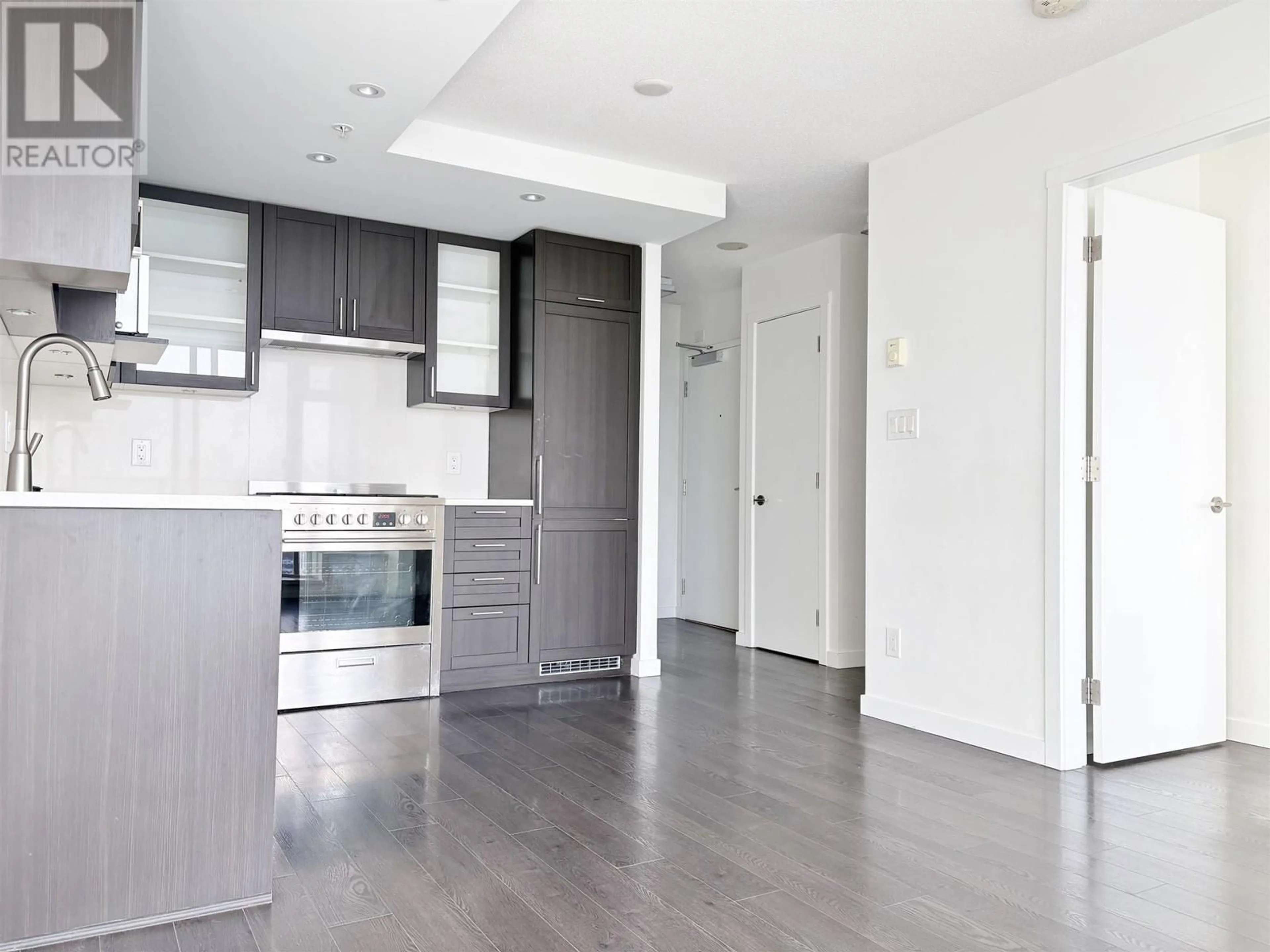 Open concept kitchen, wood/laminate floor for 3206 - 5665 BOUNDARY ROAD, Vancouver British Columbia V5R0E4