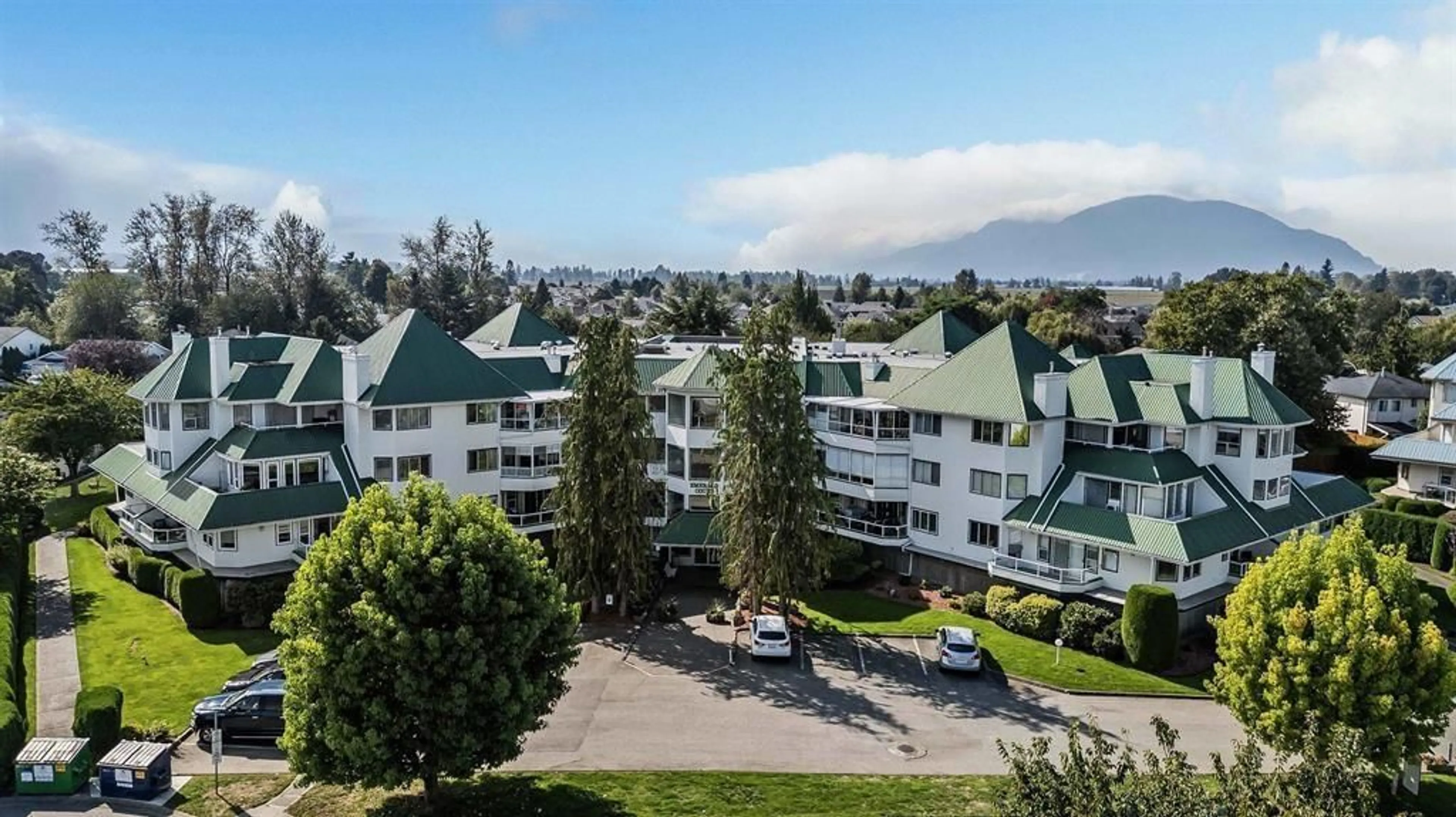 A pic from outside/outdoor area/front of a property/back of a property/a pic from drone, mountain view for 205 - 7651 AMBER DRIVE, Chilliwack British Columbia V2R3J6