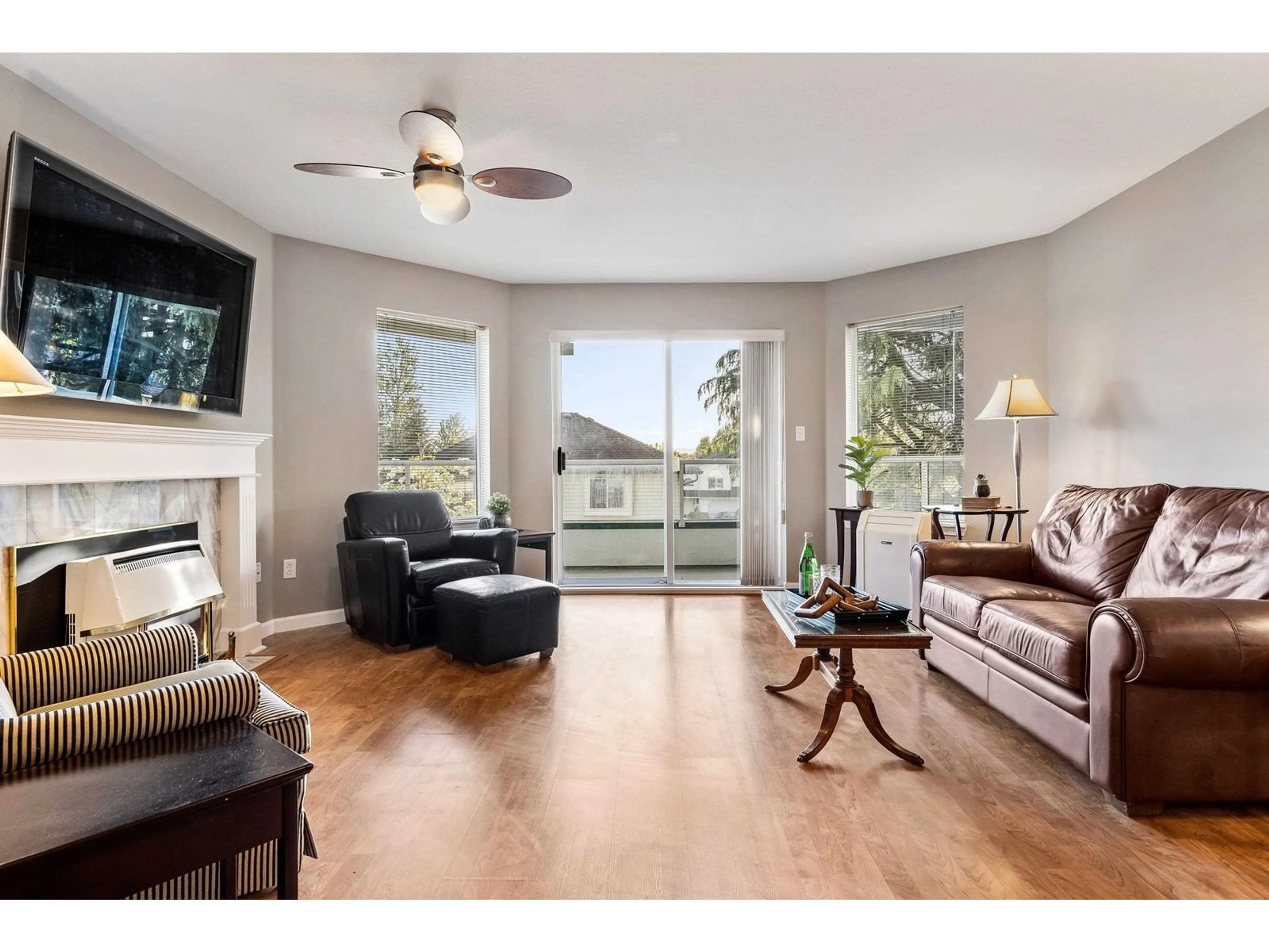 Living room with furniture, wood/laminate floor for 205 - 7651 AMBER DRIVE, Chilliwack British Columbia V2R3J6