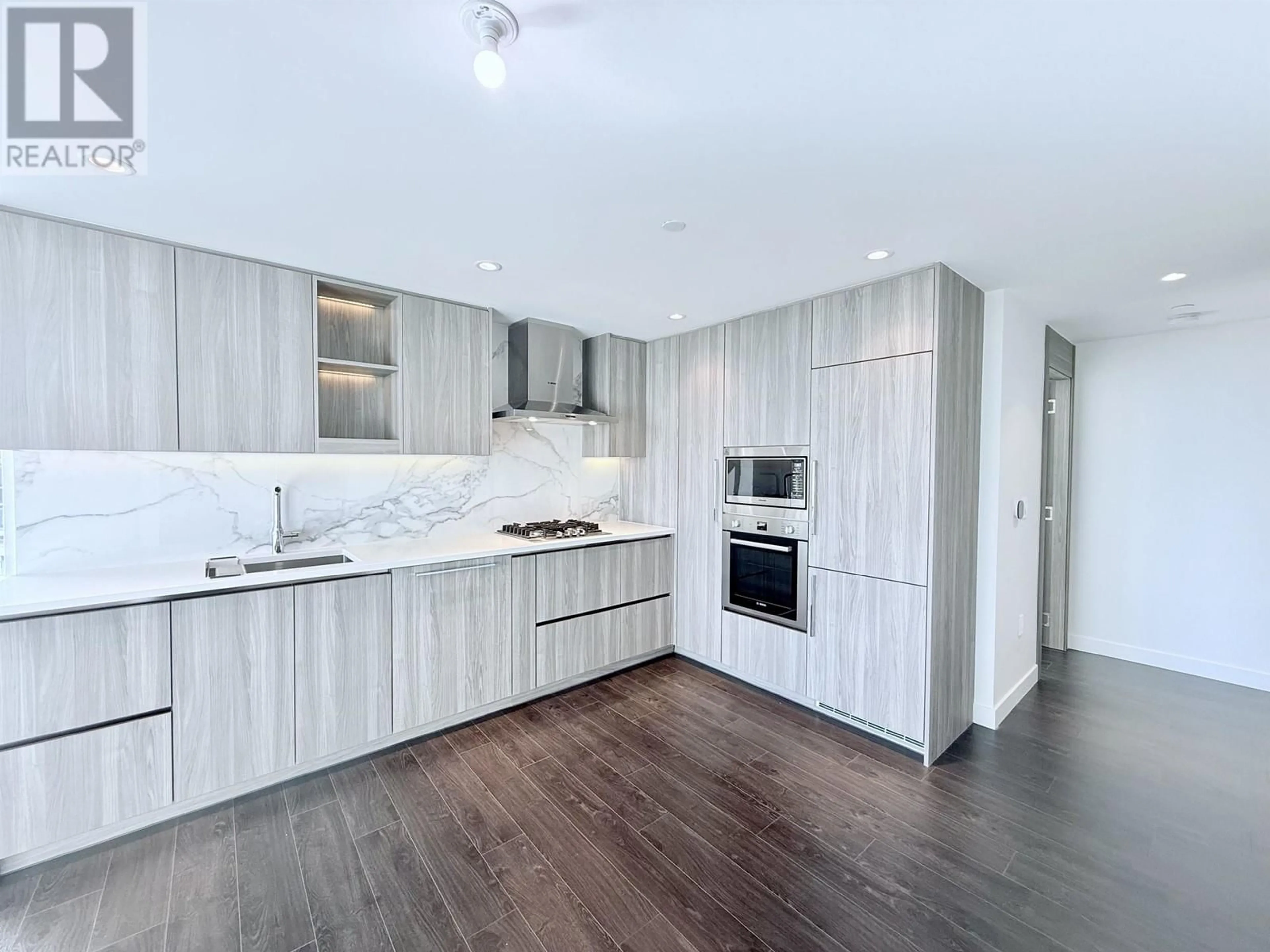 Open concept kitchen, wood/laminate floor for 710 - 8611 HAZELBRIDGE WAY, Richmond British Columbia V6X0W8