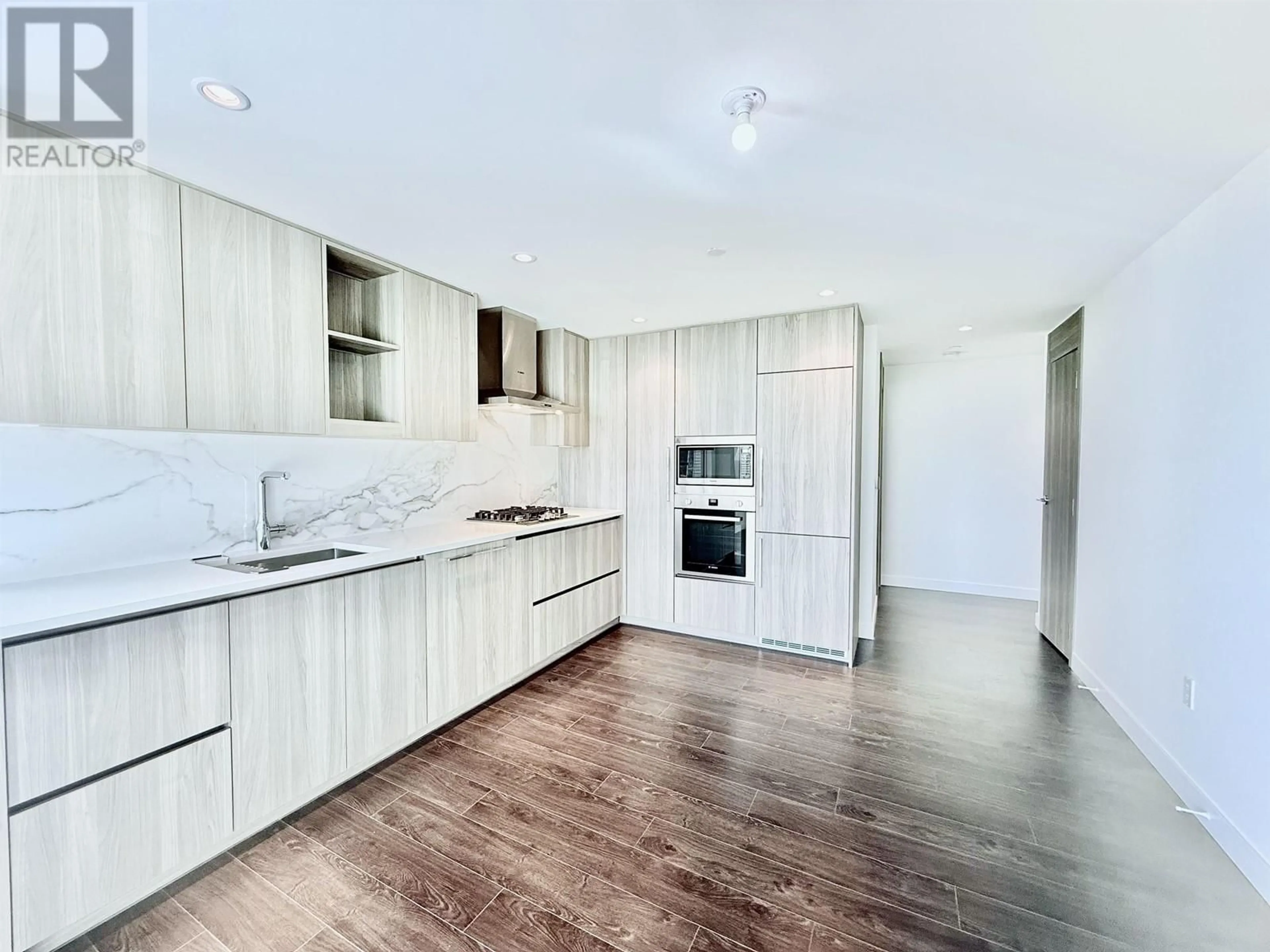 Open concept kitchen, wood/laminate floor for 710 - 8611 HAZELBRIDGE WAY, Richmond British Columbia V6X0W8