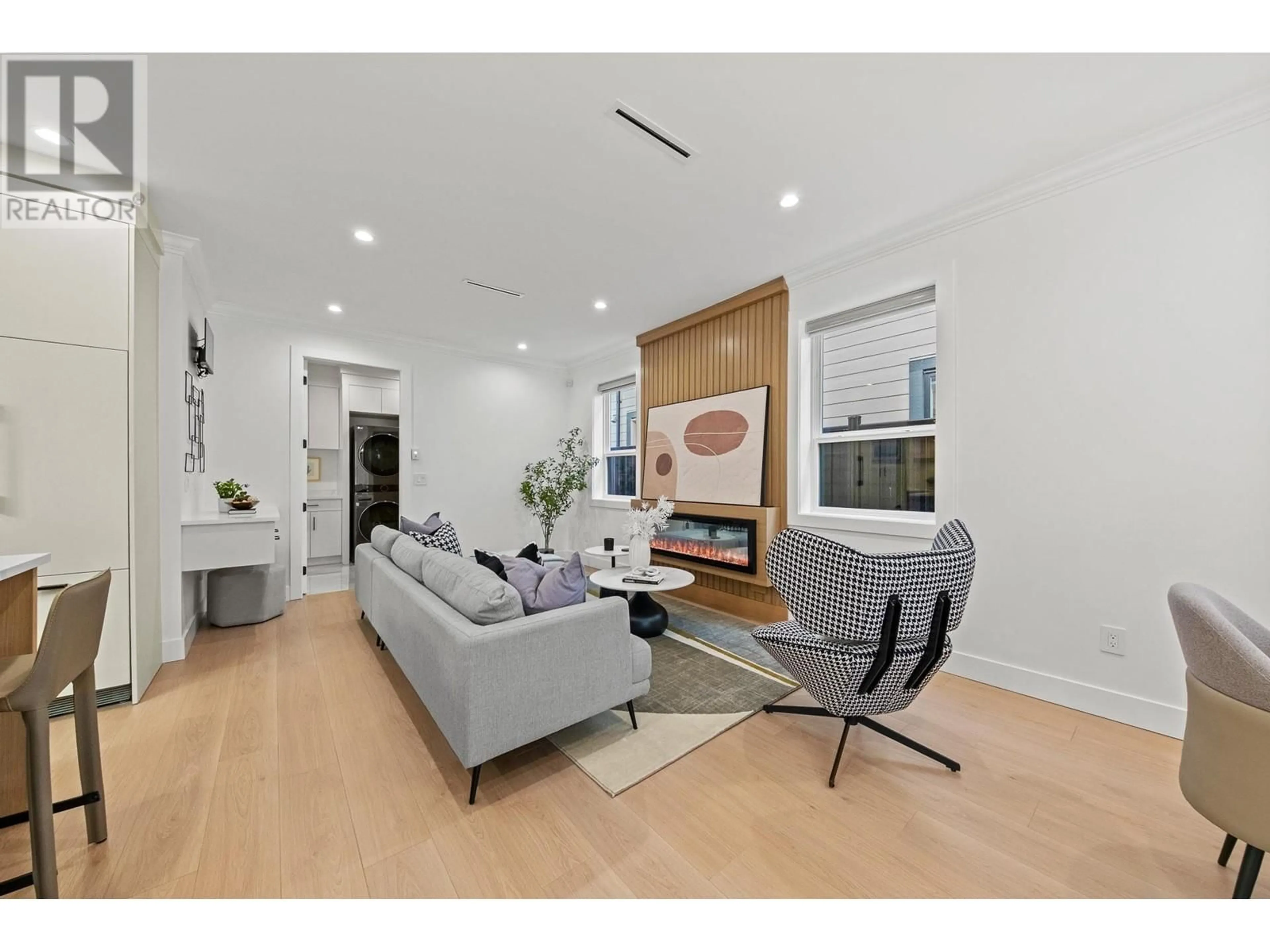 Living room with furniture, wood/laminate floor for 7220 RAILWAY AVENUE, Richmond British Columbia V7C3J8