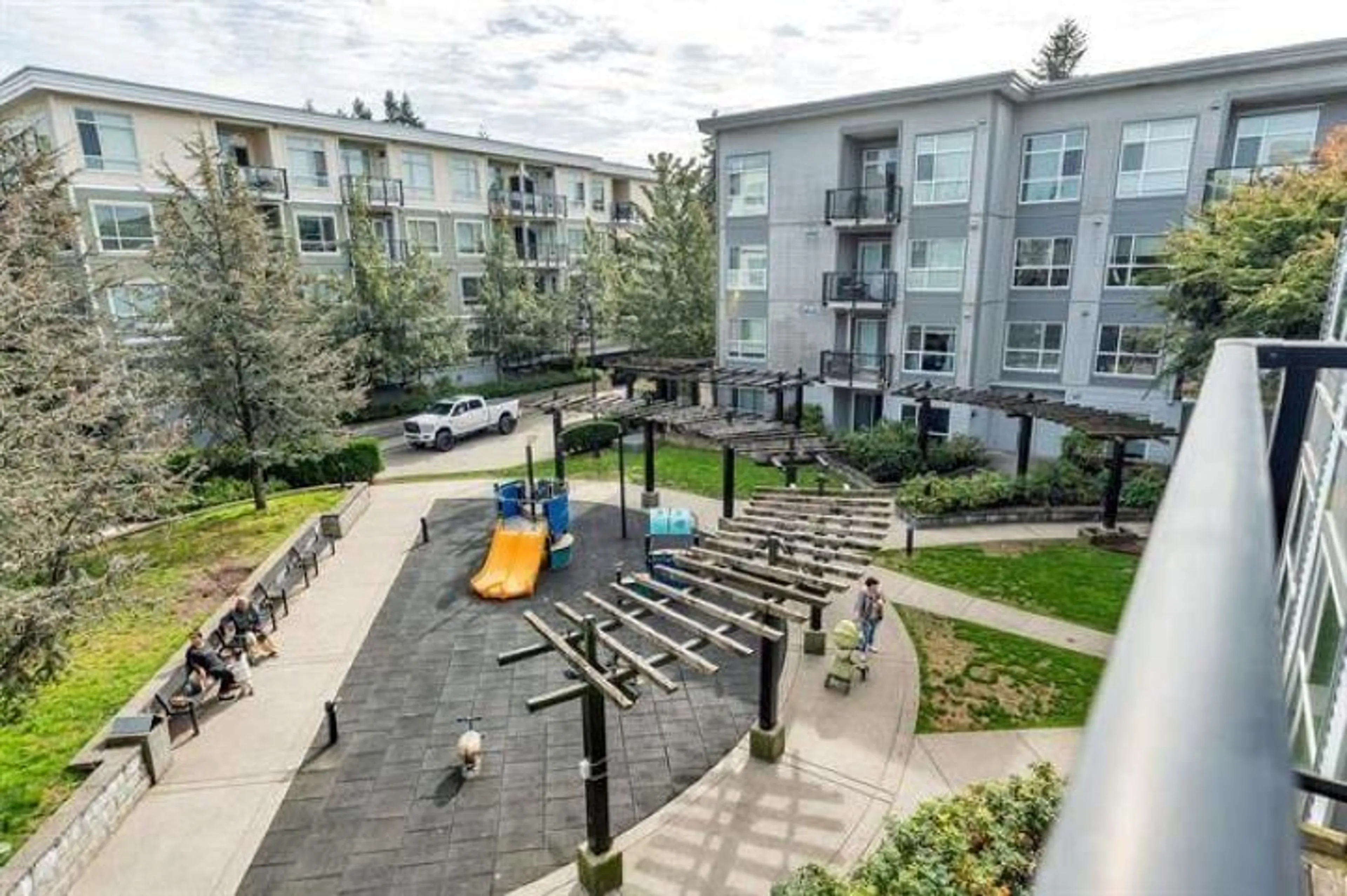 Patio, city buildings view from balcony for 417 - 13733 107A, Surrey British Columbia V3T0B7