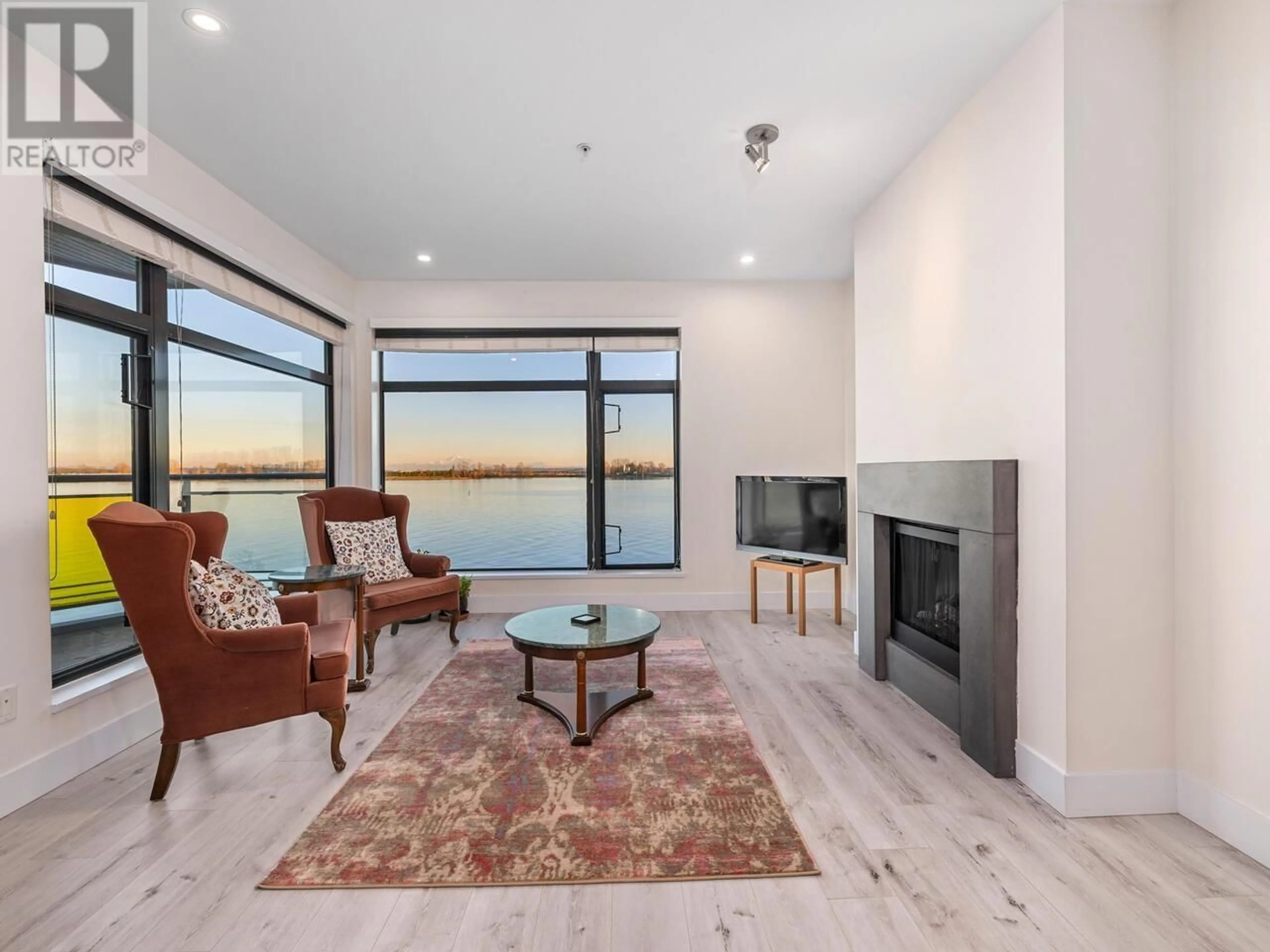 Living room with furniture, wood/laminate floor for 310 - 14200 RIVERPORT WAY, Richmond British Columbia V6W1M4