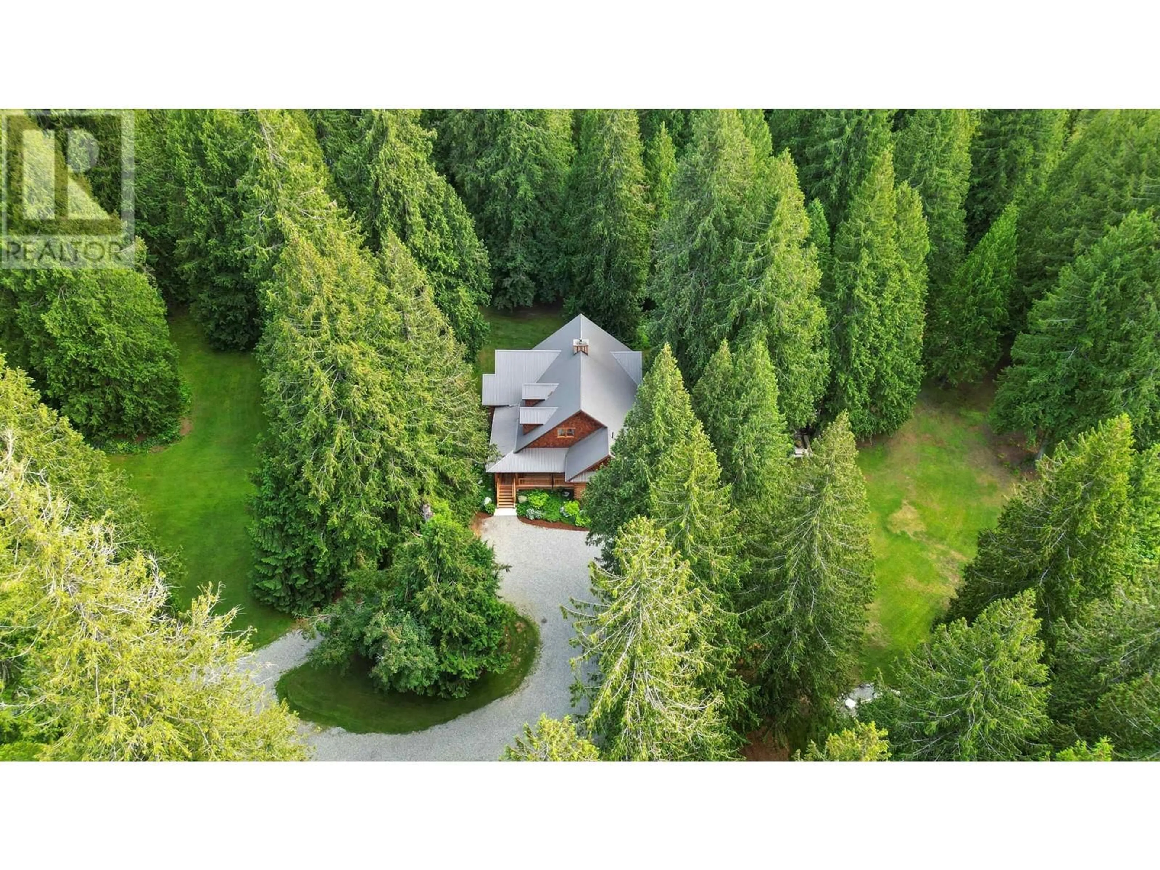 A pic from outside/outdoor area/front of a property/back of a property/a pic from drone, forest/trees view for 1710 HIGHWAY 99, Pemberton British Columbia V0N2L0