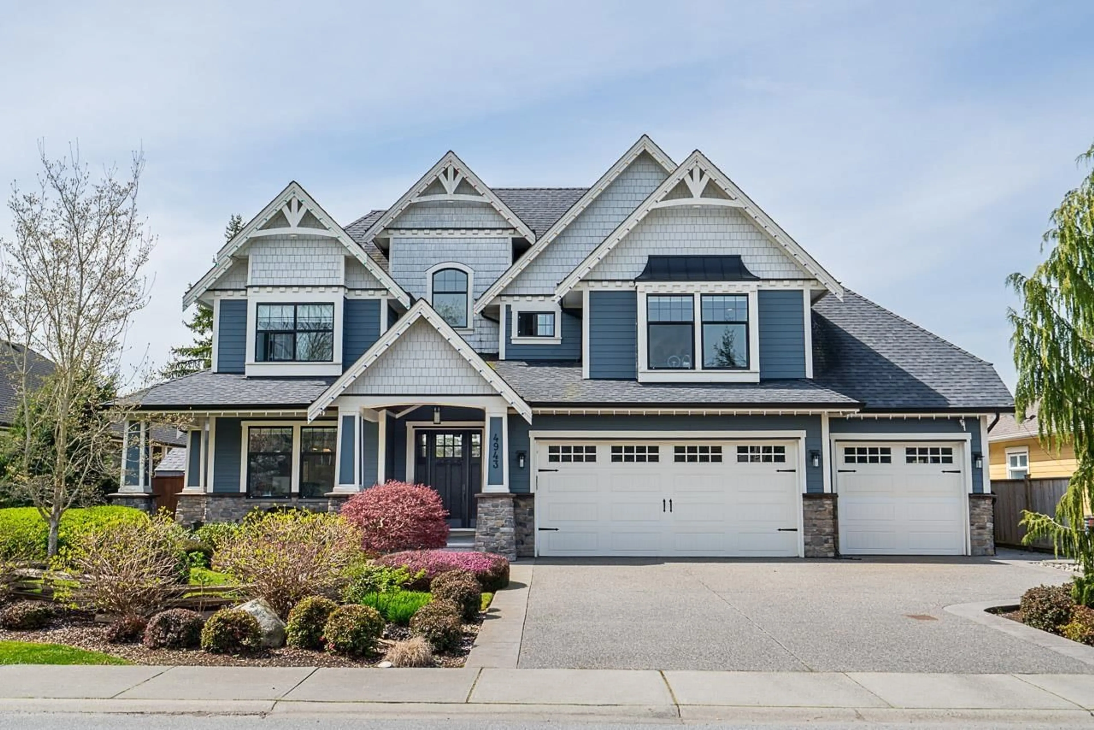Home with vinyl exterior material, street for 4943 215, Langley British Columbia V3A2M1