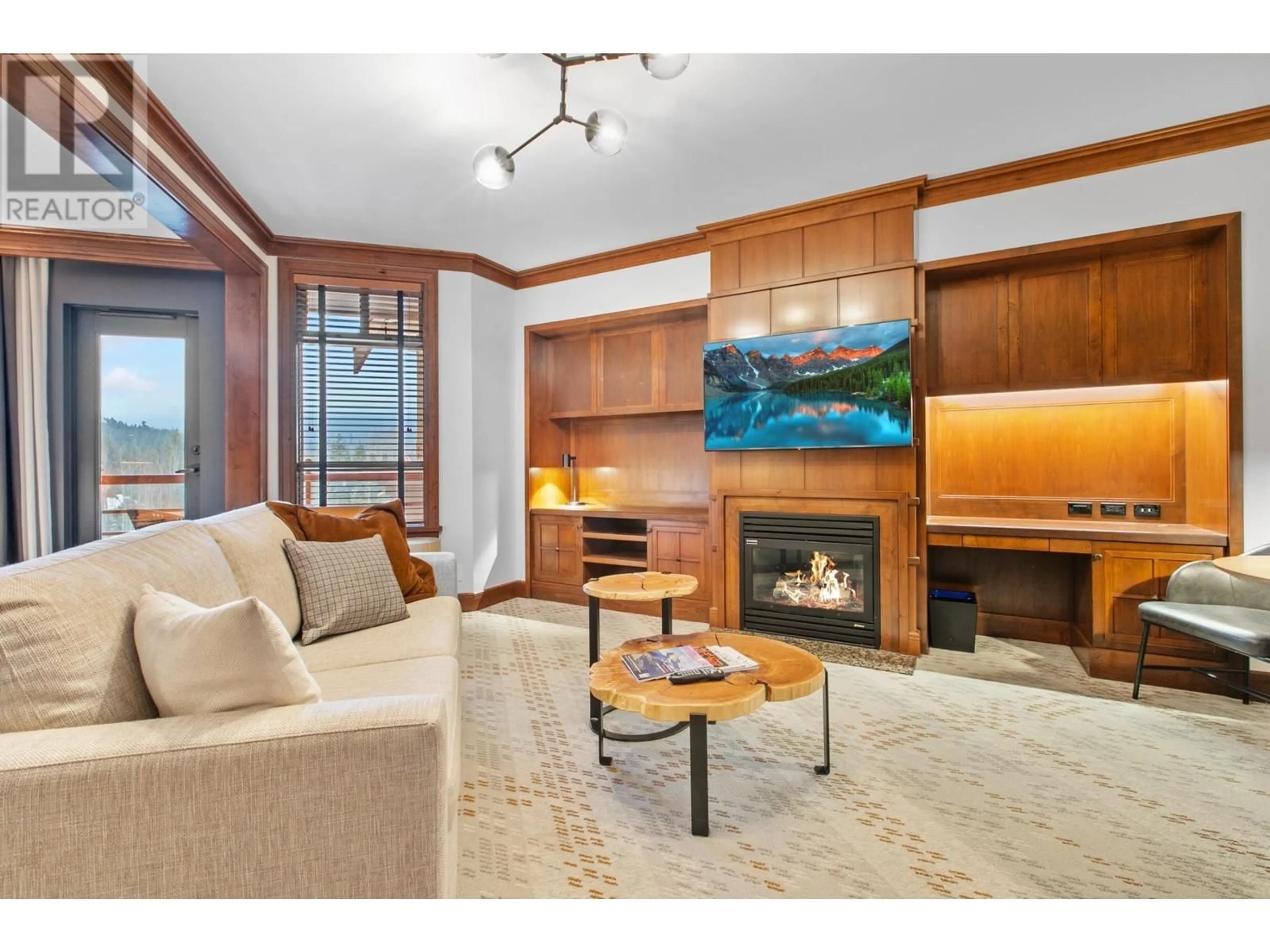 Living room with furniture, wood/laminate floor for 707 - 4591 BLACKCOMB WAY, Whistler British Columbia V8E0Y4