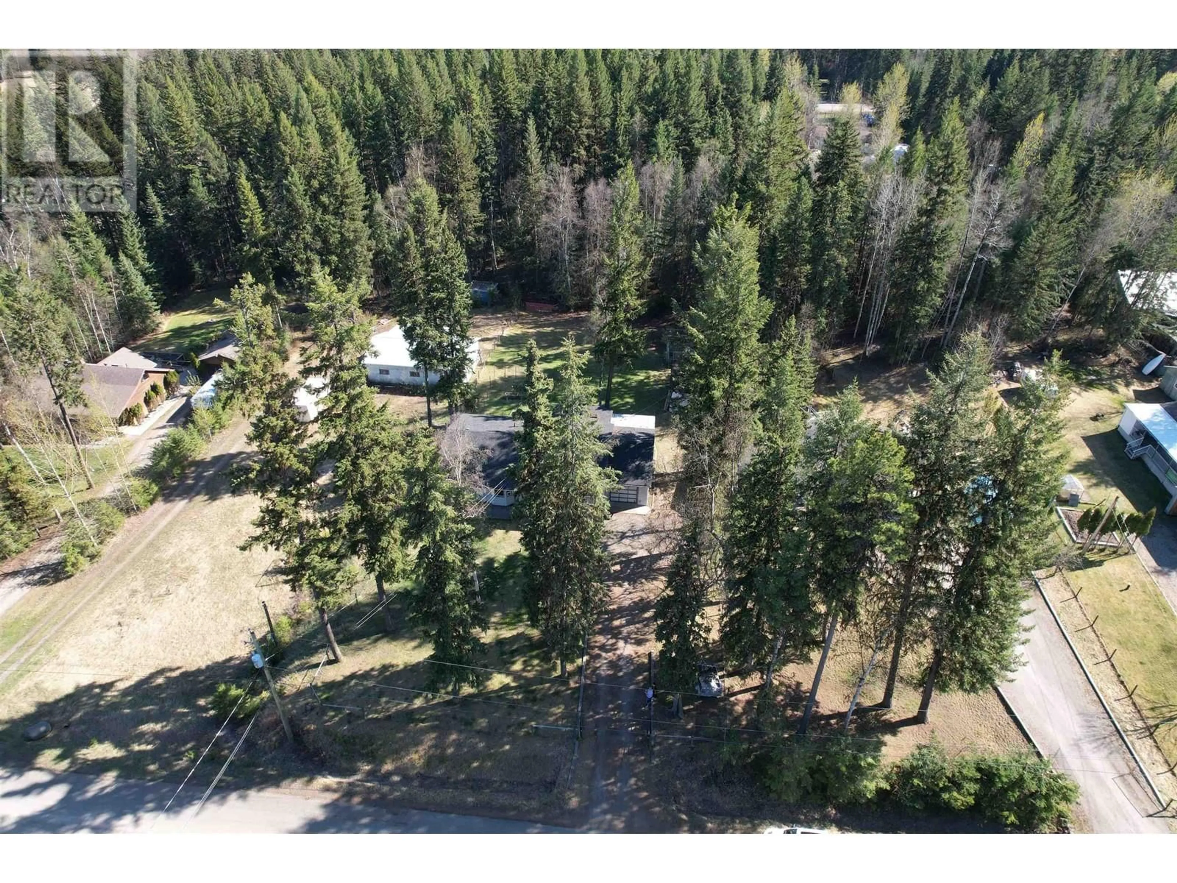 A pic from outside/outdoor area/front of a property/back of a property/a pic from drone, forest/trees view for 2401 TANOKA ROAD, Quesnel British Columbia V2J7B8