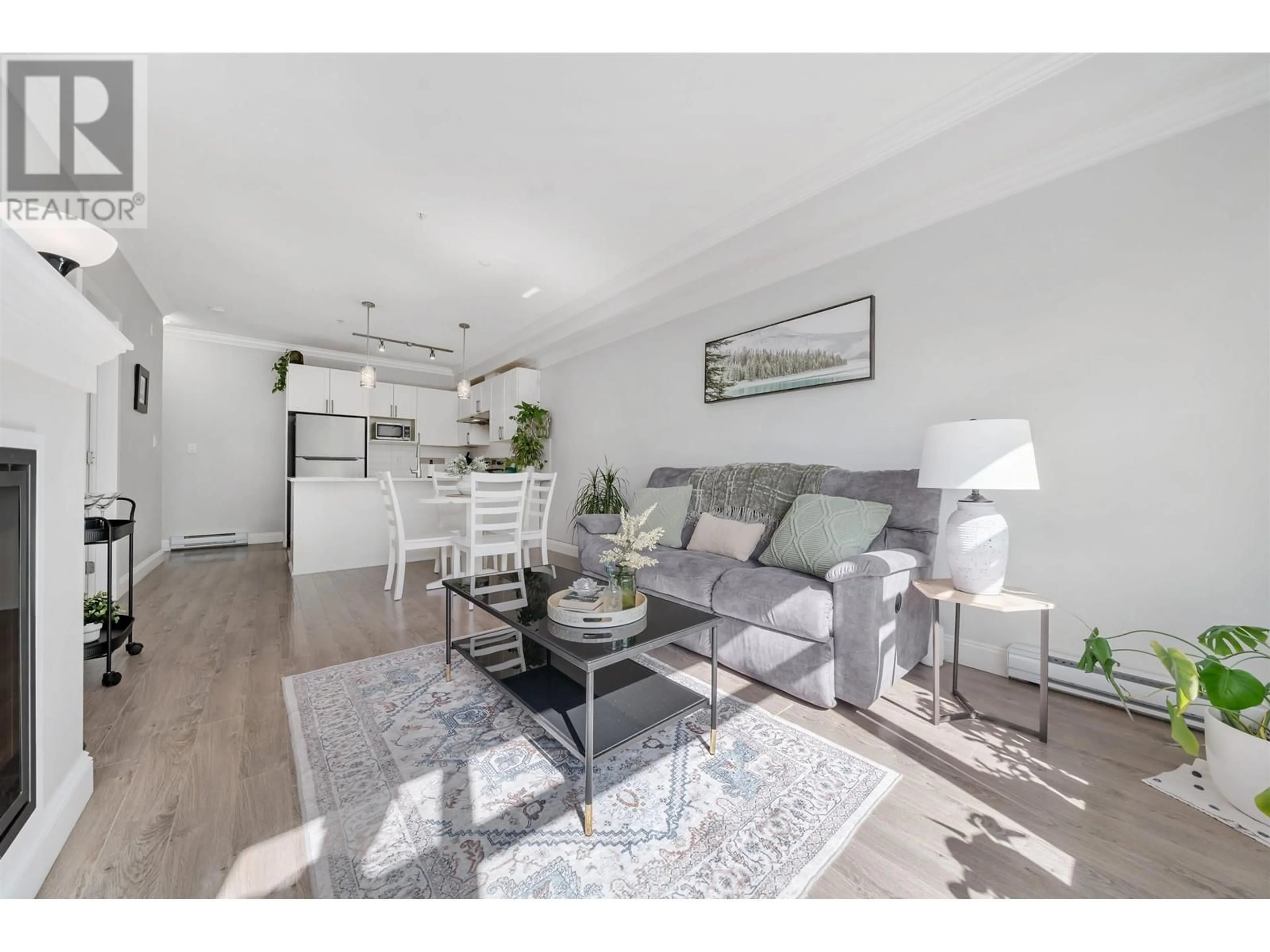 Living room with furniture, wood/laminate floor for 204 - 11566 224 STREET, Maple Ridge British Columbia V2X9C9