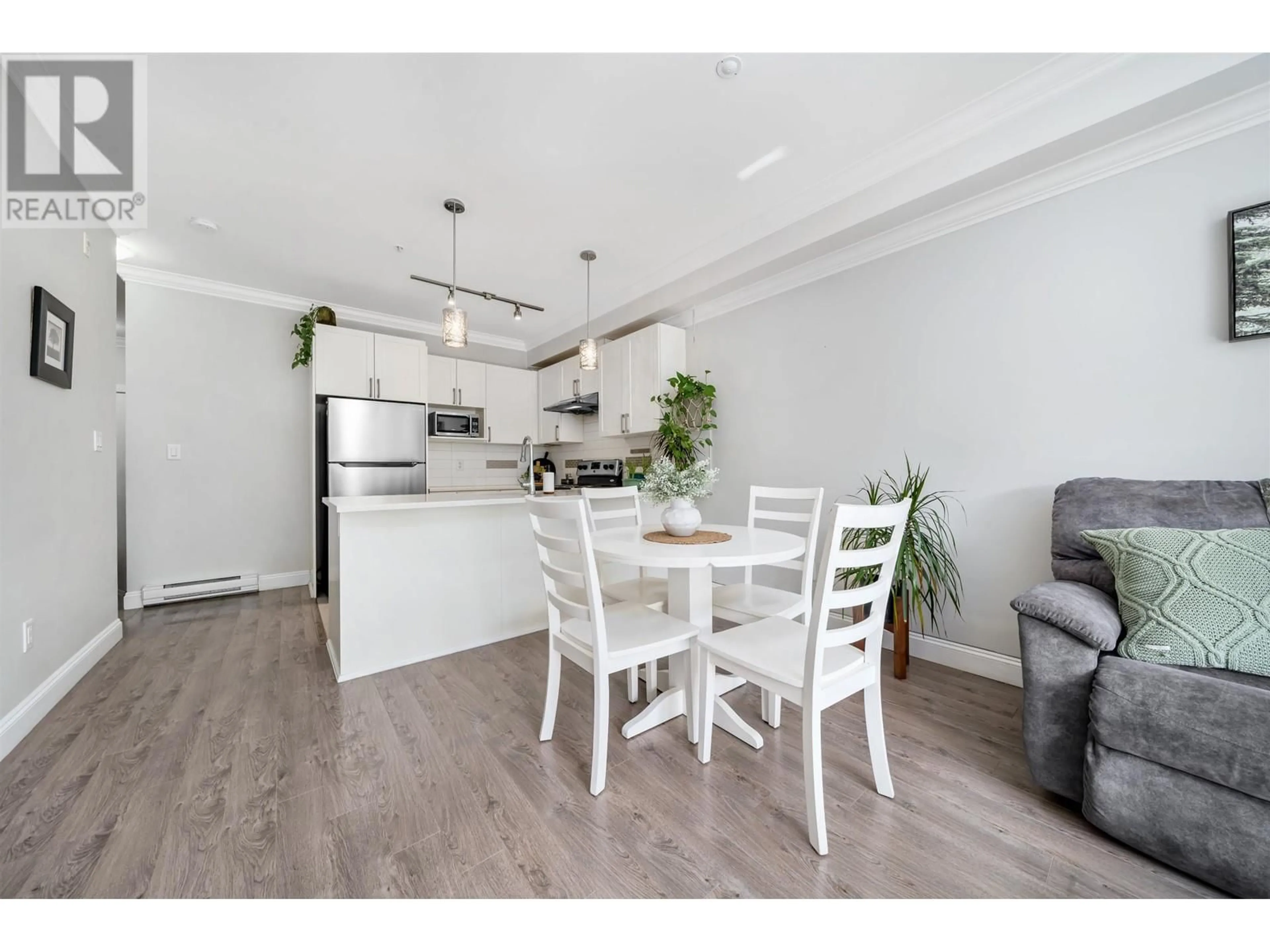 Open concept kitchen, wood/laminate floor for 204 - 11566 224 STREET, Maple Ridge British Columbia V2X9C9