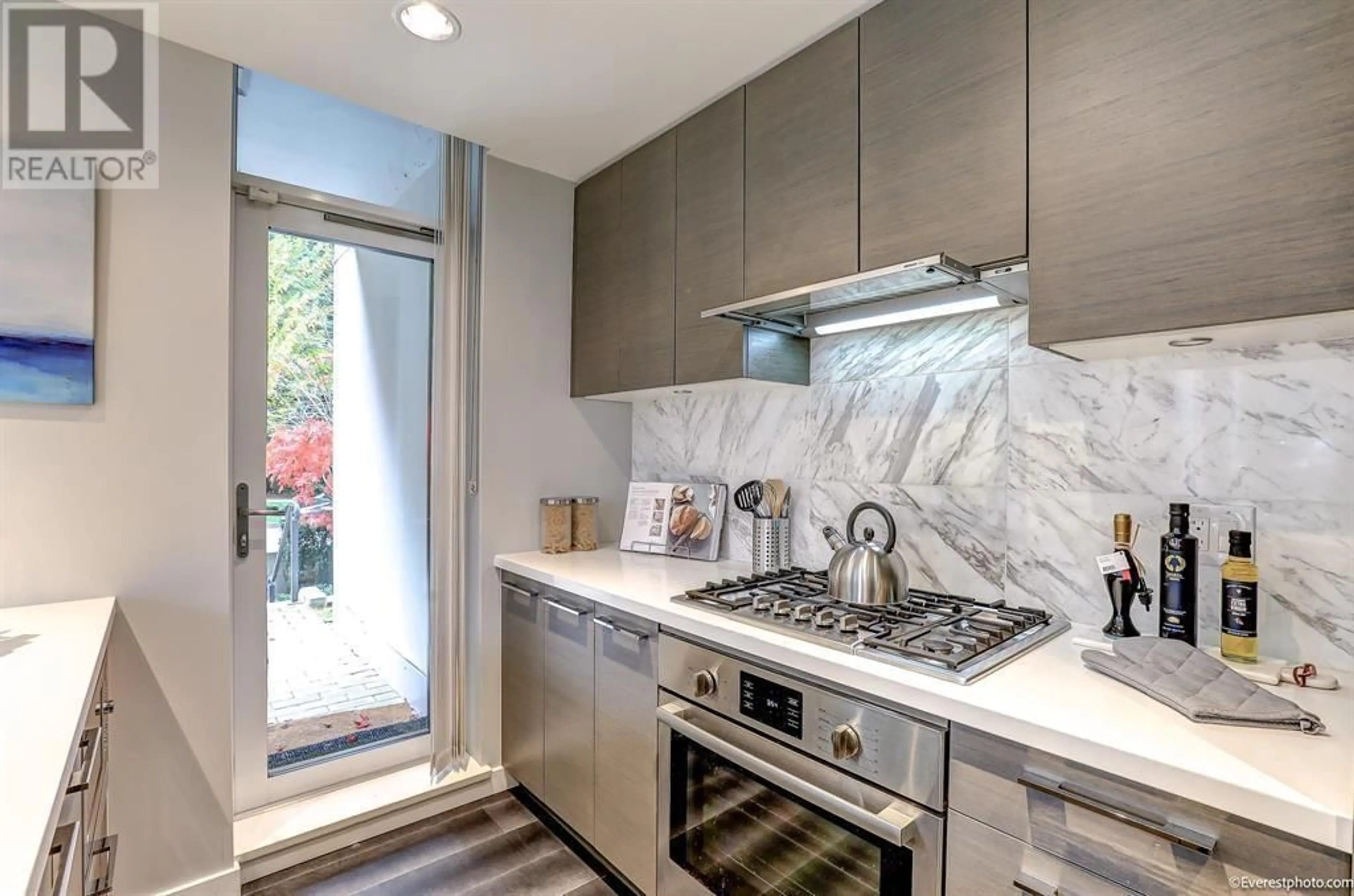 Contemporary kitchen, ceramic/tile floor for 102 - 5628 BIRNEY AVENUE, Vancouver British Columbia V6S0H7