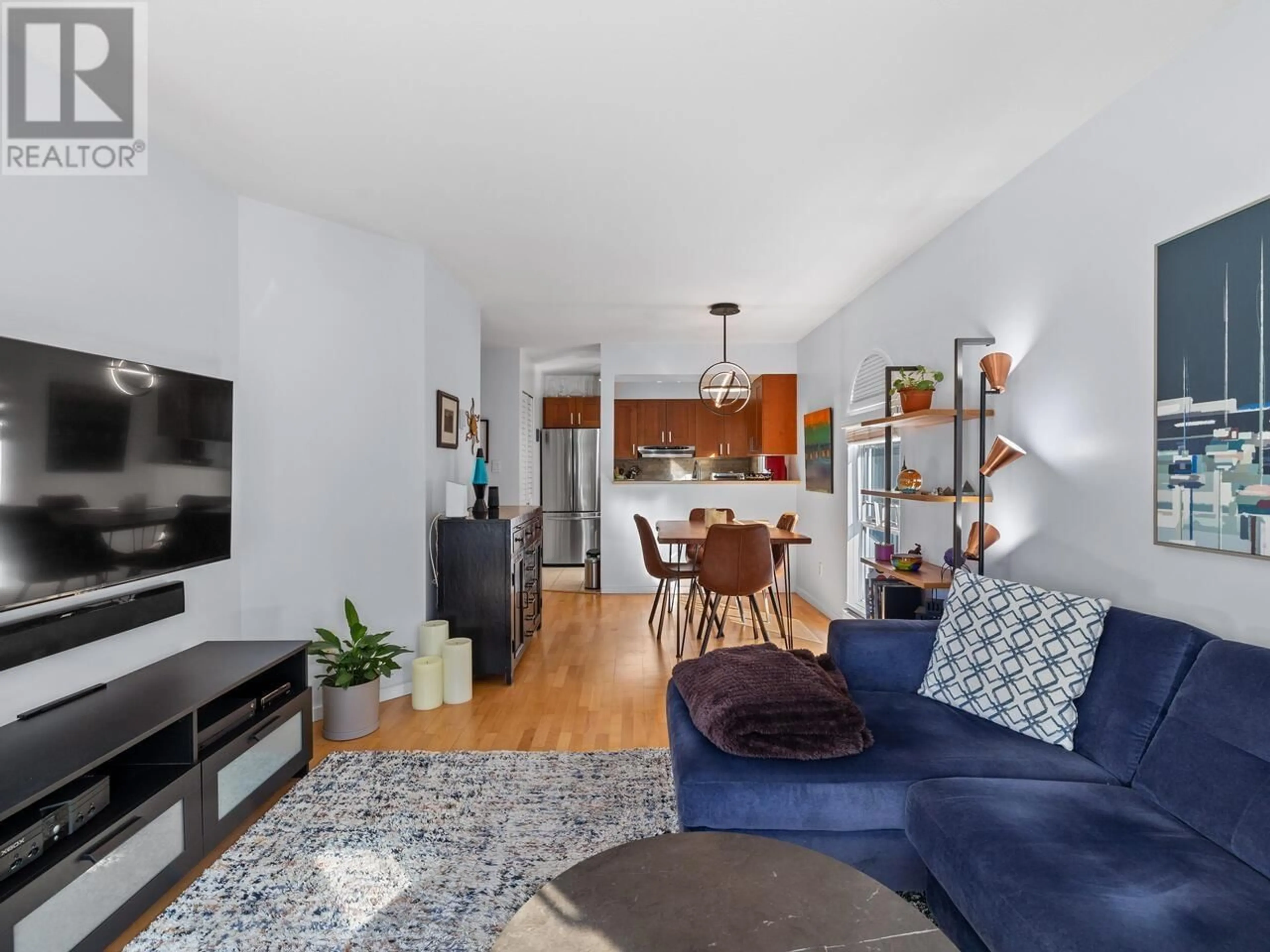 Living room with furniture, wood/laminate floor for 211 - 1510 NELSON STREET, Vancouver British Columbia V6G1M1