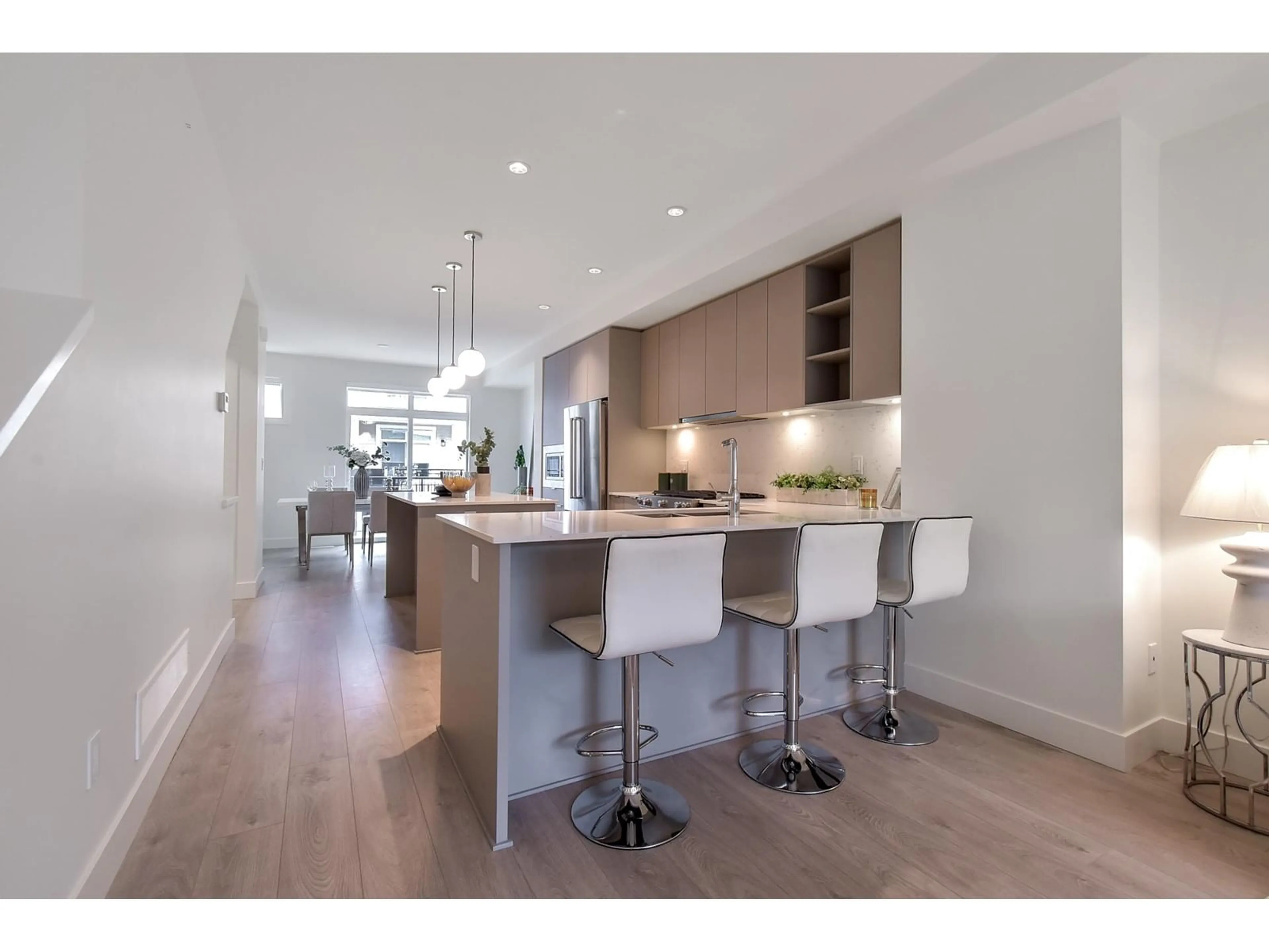Open concept kitchen, wood/laminate floor for 59 - 16561 17A, Surrey British Columbia V3Z1J3