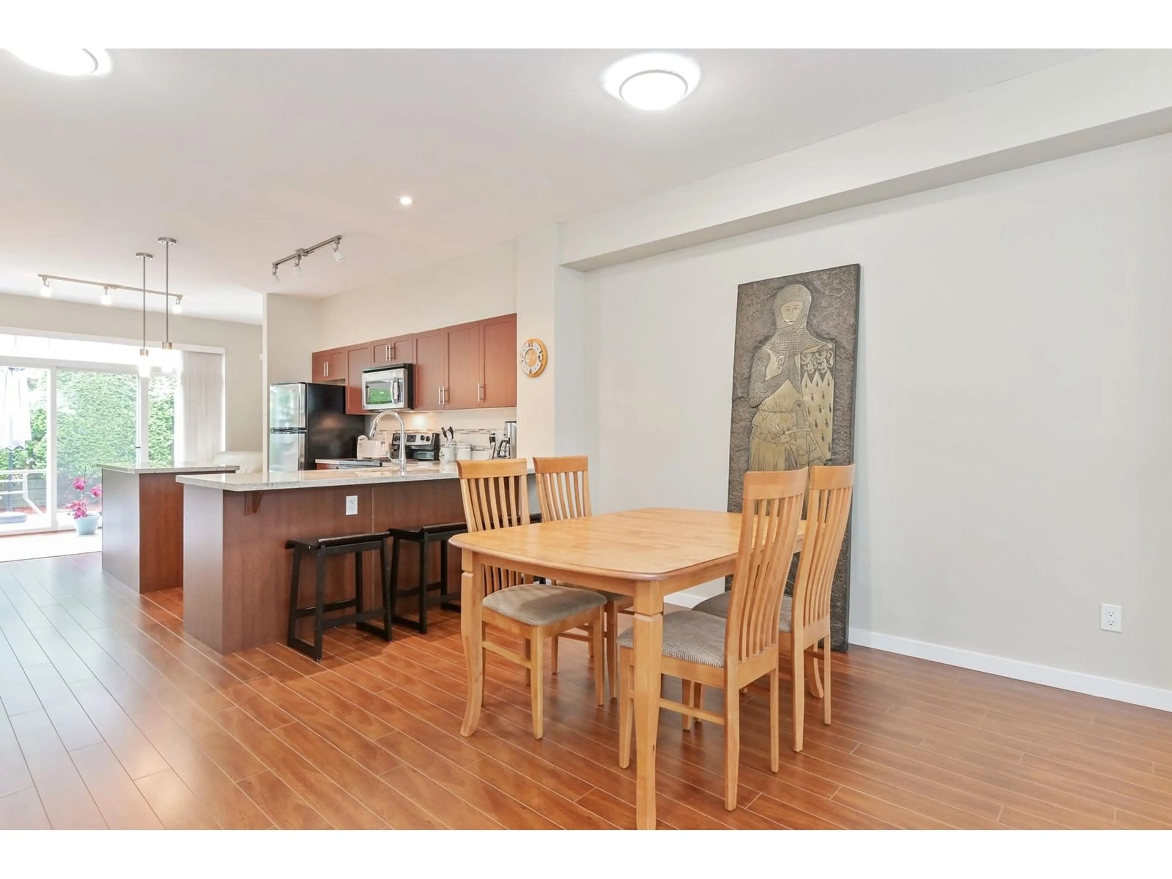 Open concept kitchen, wood/laminate floor for 45 - 14356 63A, Surrey British Columbia V3X0E3