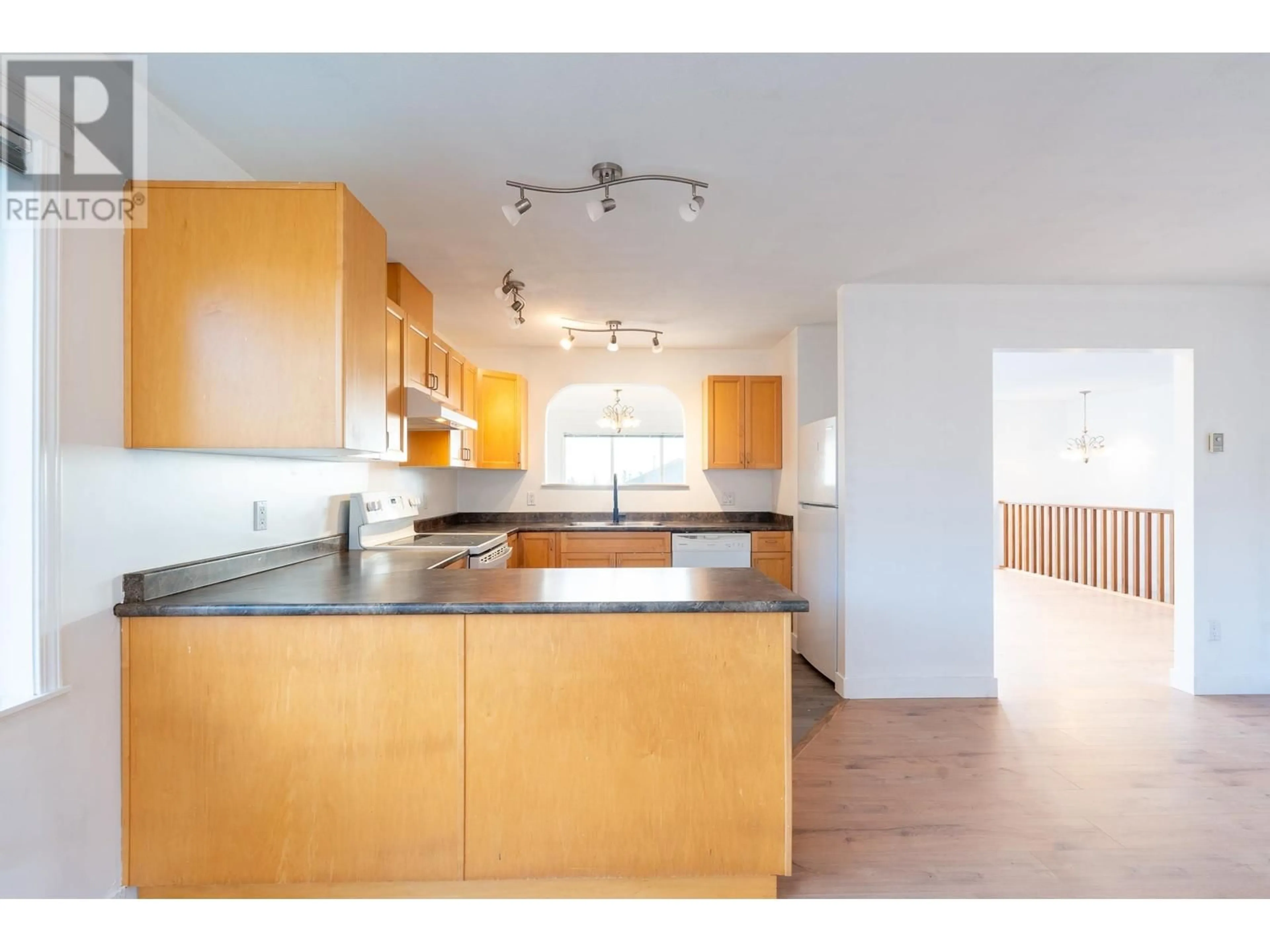 Open concept kitchen, wood/laminate floor for 5683 EMILY WAY, Sechelt British Columbia V7Z0N5