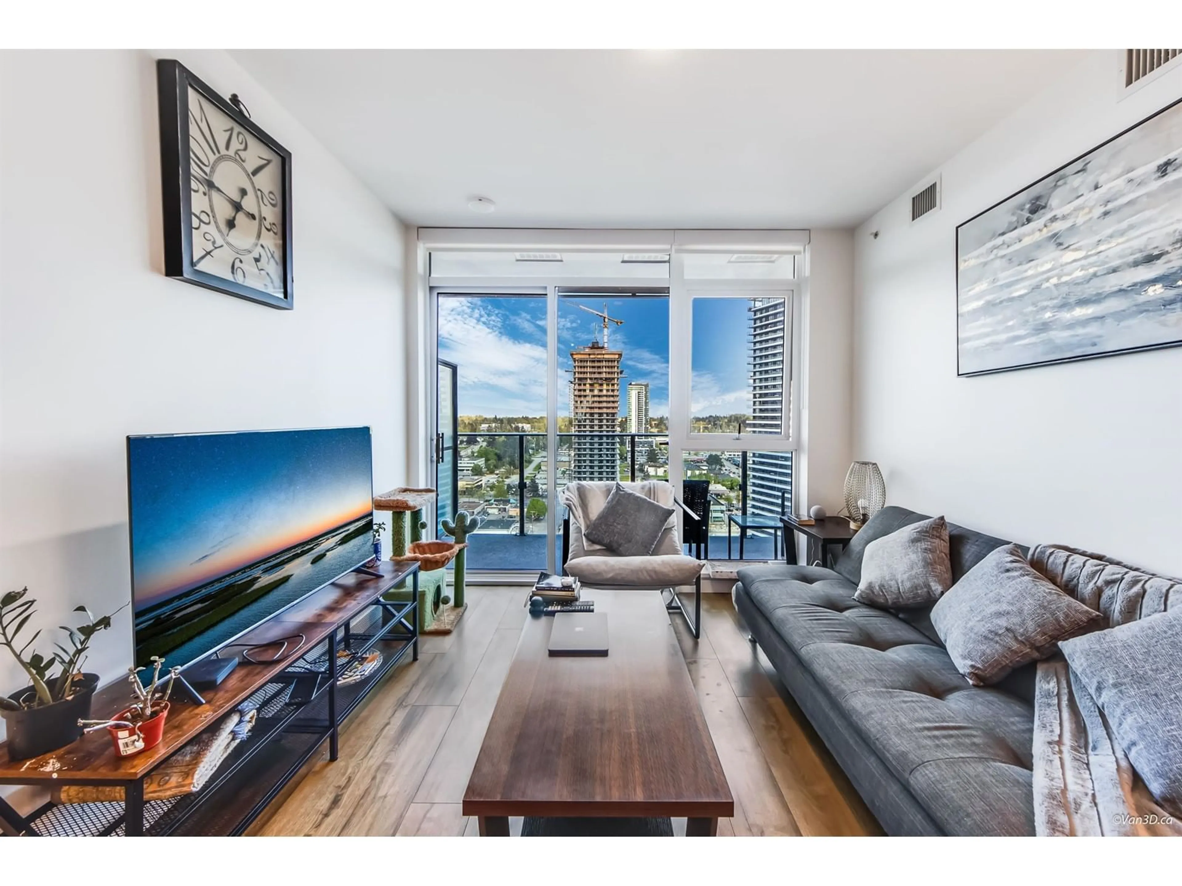 Living room with furniture, wood/laminate floor for 2306 - 13428 105, Surrey British Columbia V6Y1G8