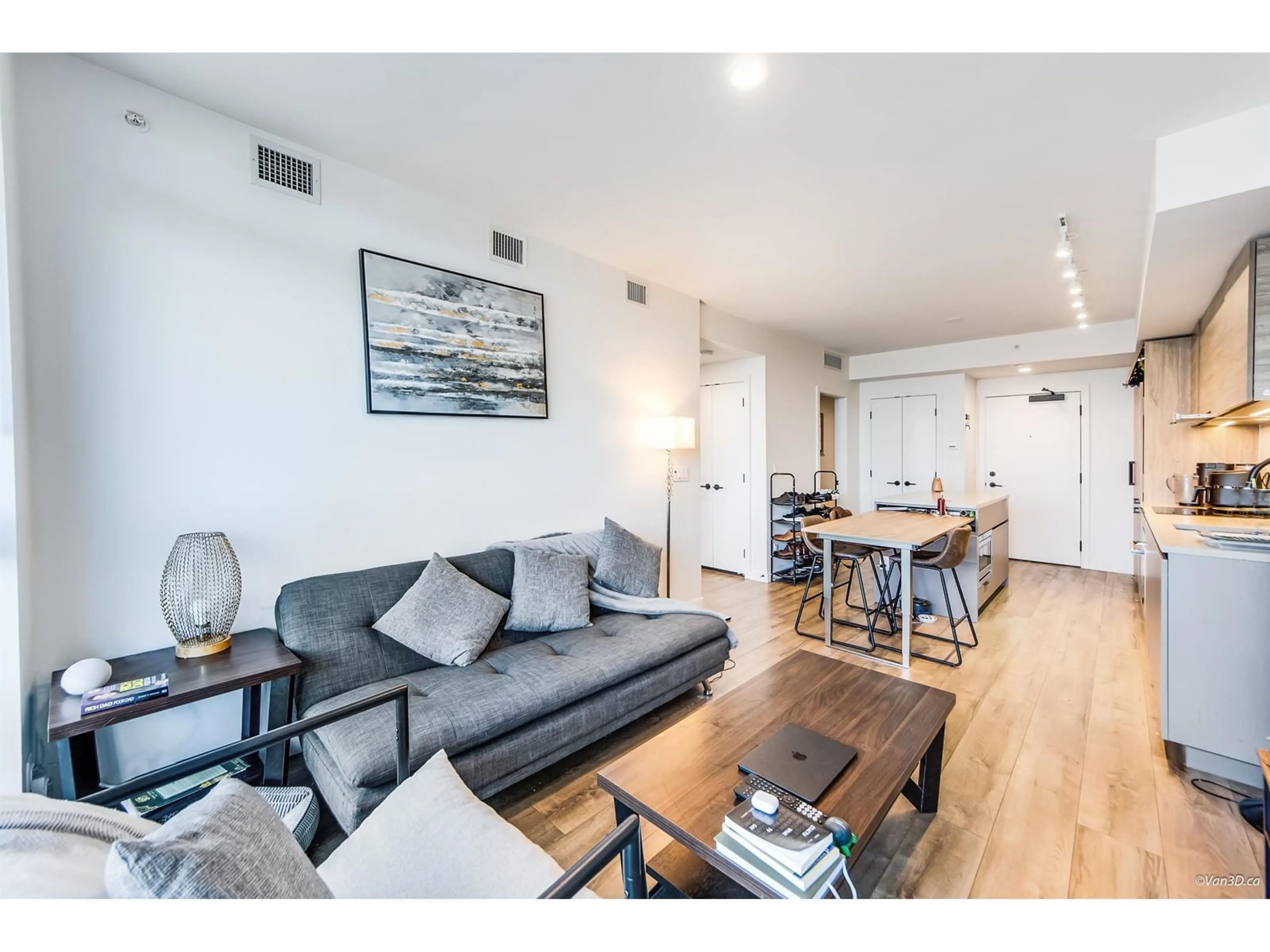Living room with furniture, wood/laminate floor for 2306 - 13428 105, Surrey British Columbia V6Y1G8
