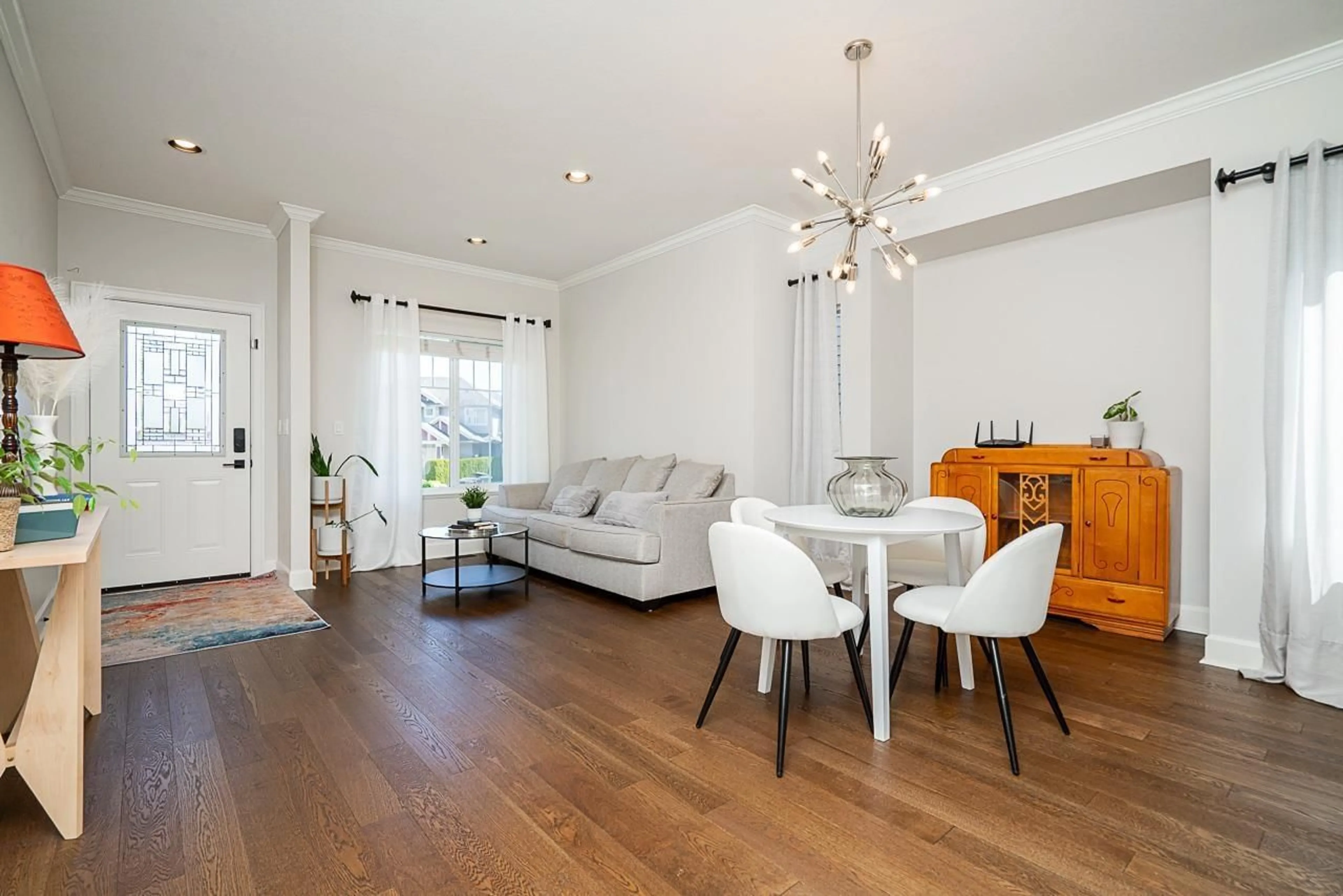 Living room with furniture, wood/laminate floor for 5939 165A, Surrey British Columbia V3S4N9